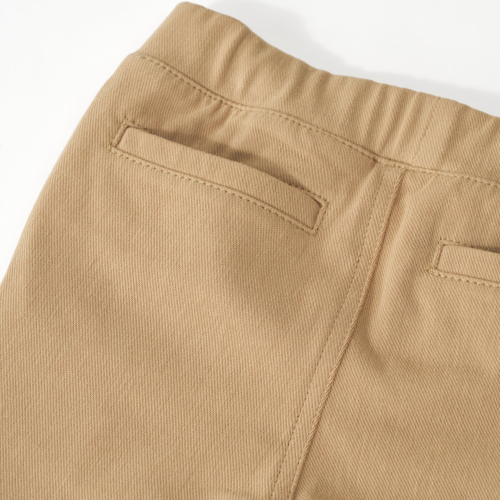 Close up flat lay of the back pocket details on the Toasted Hazelnut Denim Jogger