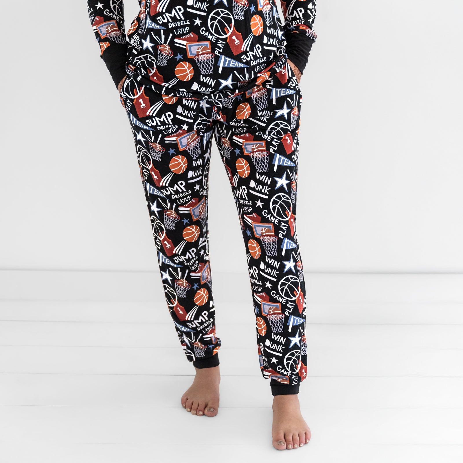 Front view of a woman wearing the Black Slam Dunk bamboo pajama pants