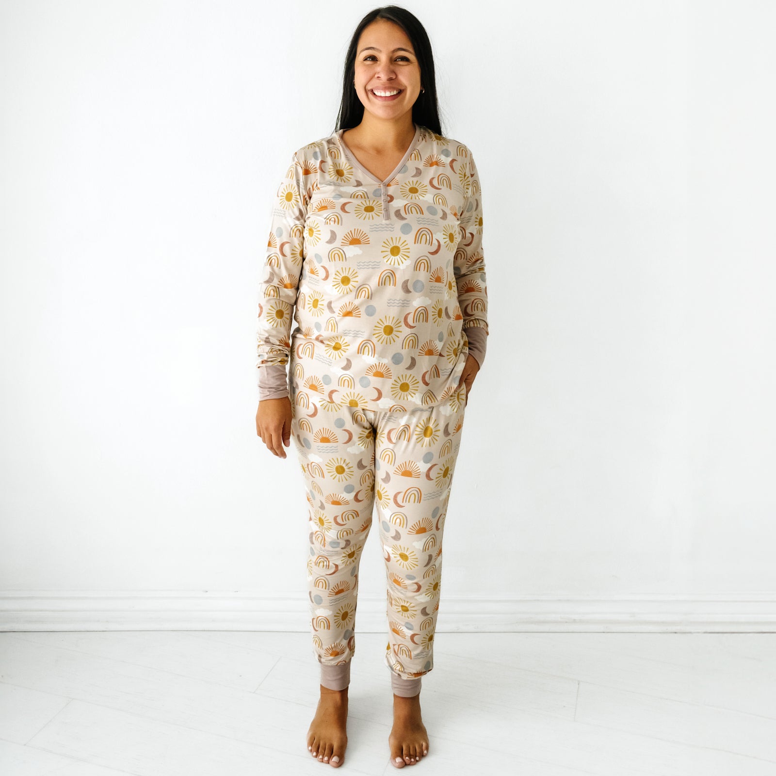 Woman wearing a Desert Sunrise women's pajama top paired with matching women's pajama pants
