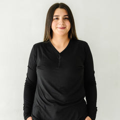 Close up image of a woman wearing a Black women's pajama top