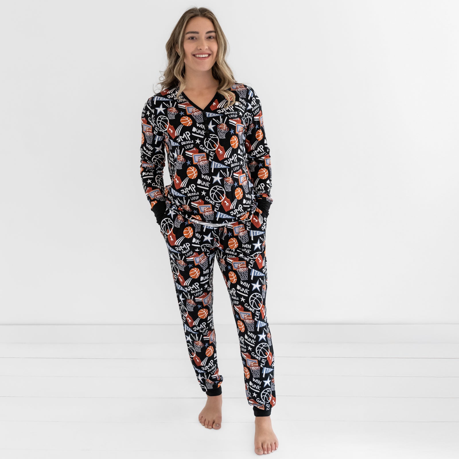 Woman wearing the Black Slam Dunk bamboo pajama top and bottoms