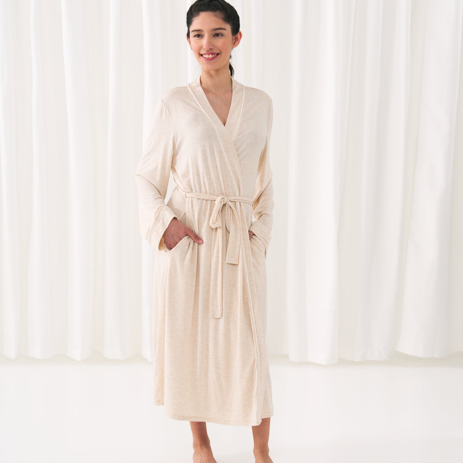 woman posing wearing a Heather Oatmeal women's robe
