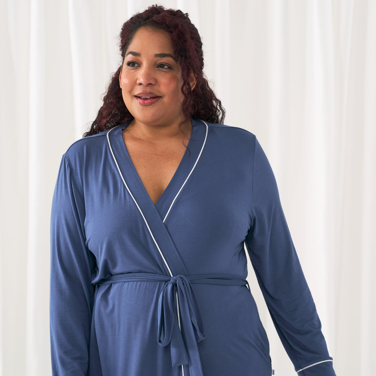 Close up image of a woman wearing an Indigo women's robe