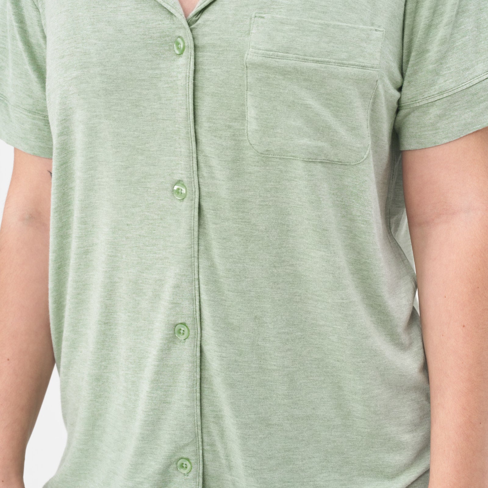 close up image of a woman wearing a Heather Sage women's PJ short sleeve and shorts pj set focusing on the buttons of the pj top