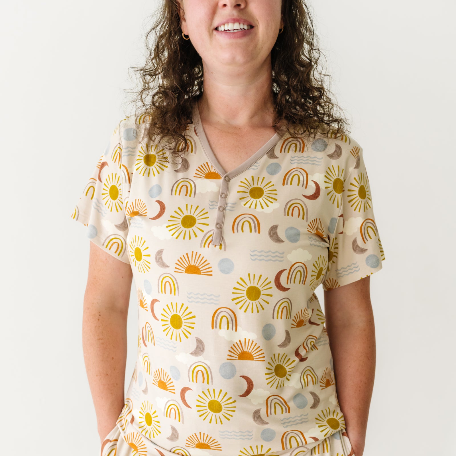 Close up image of a woman wearing a Desert Sunrise women's short sleeve pajama top