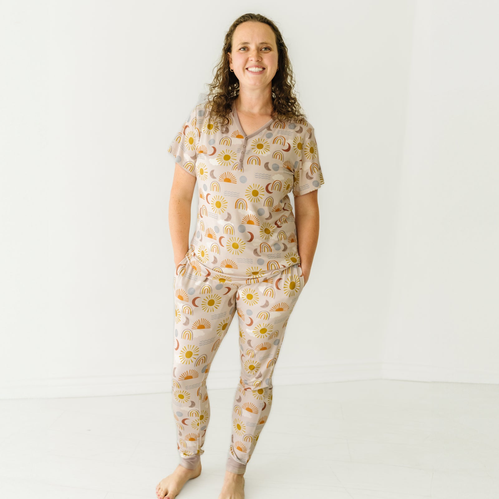 Image of a woman wearing women's Desert Sunrise women's pajama top and matching women's pajama pants