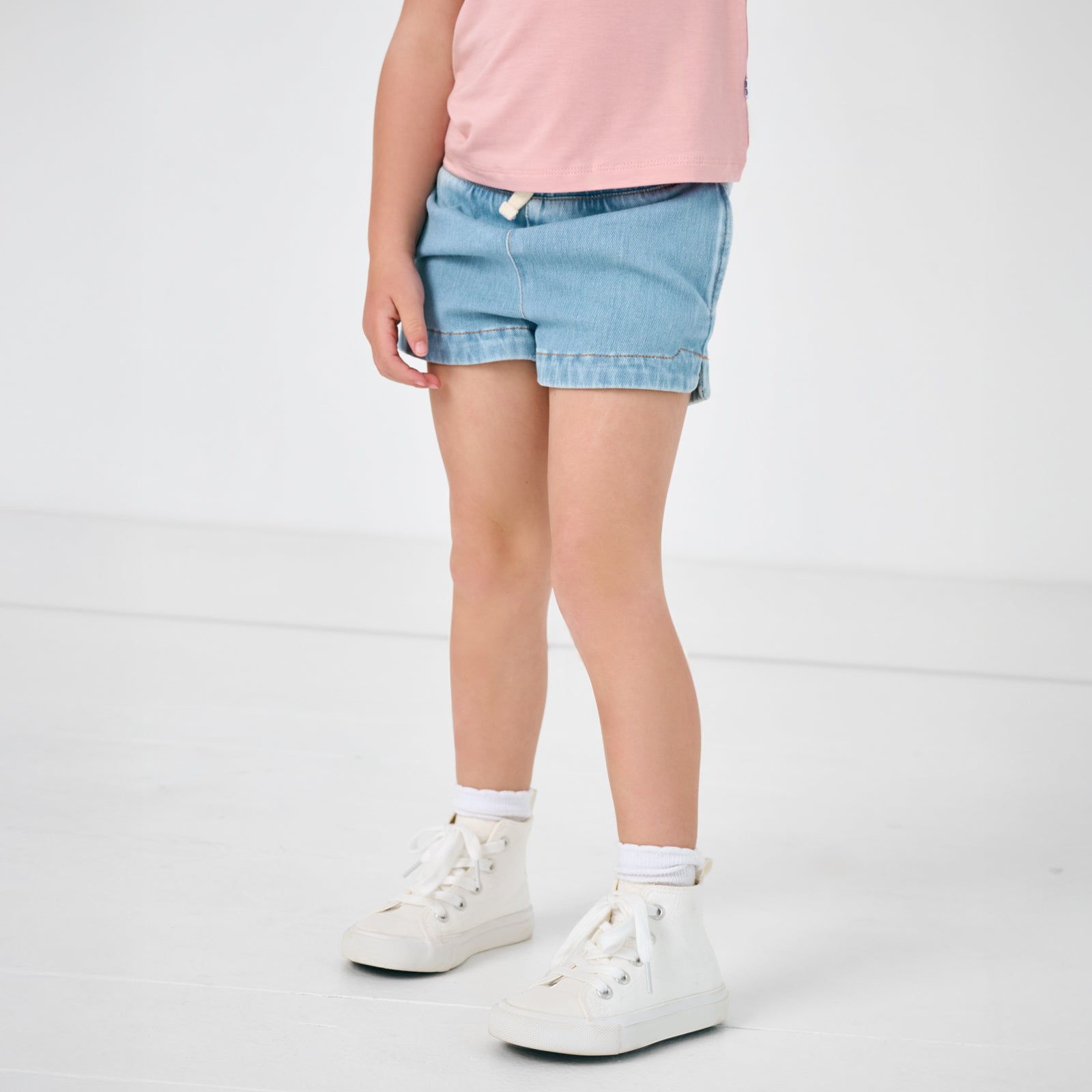 Close up of child wearing the Light Blue Denim Shorts