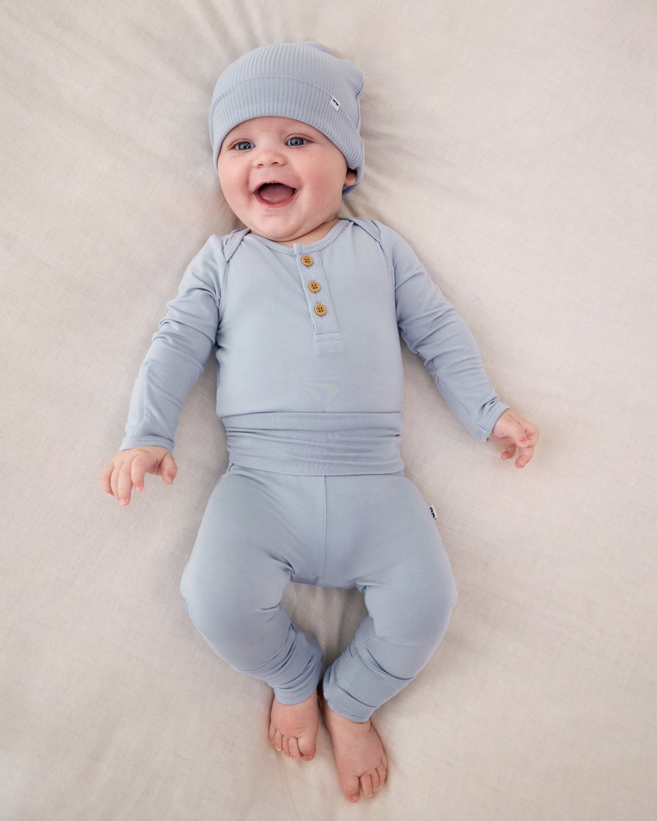 Aerial view of baby wearing the Light Fog Fold-Over Legging