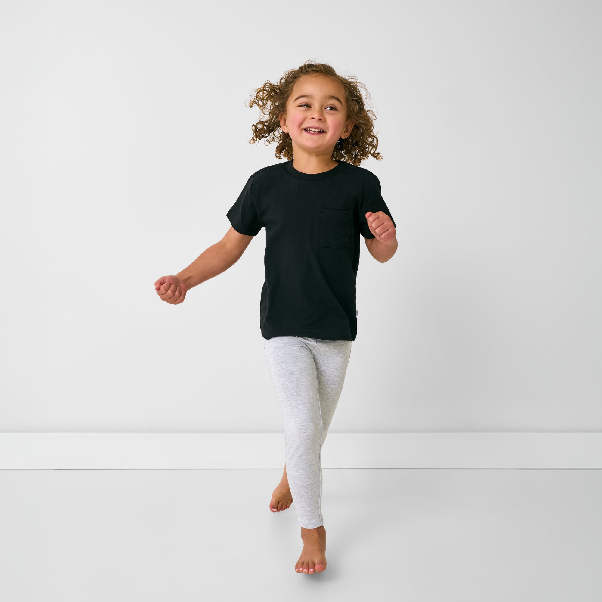 Child in motion wearing the Light Heather Gray Legging
