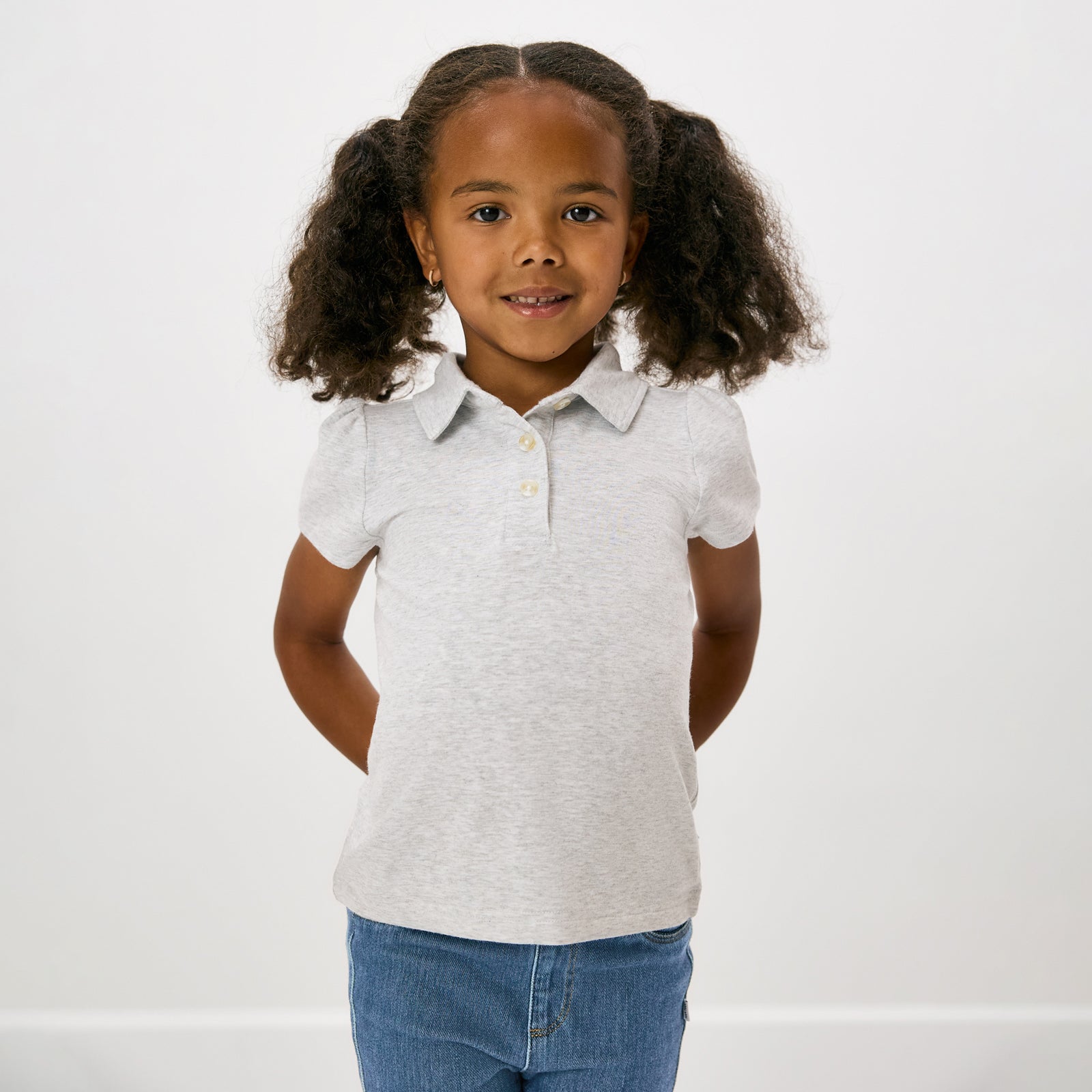 Standing child wearing the Light Heather Gray Puff Sleeve Polo