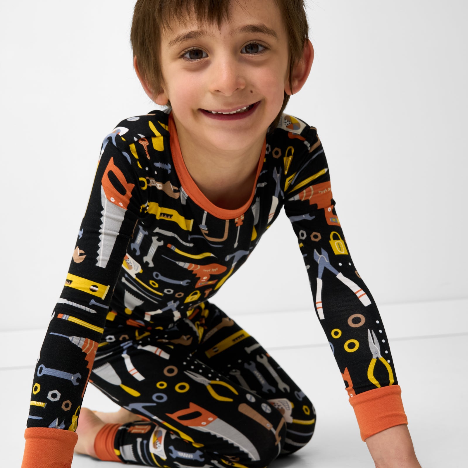 Close up of child wearing the Little Builders Two-Piece Pajama Set