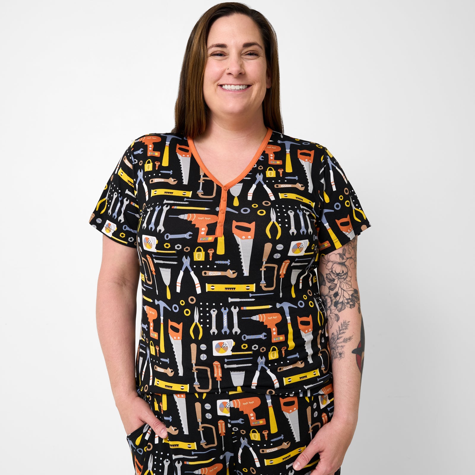 Standing woman wearing the Little Builders Women's Short Sleeve Pajama Top