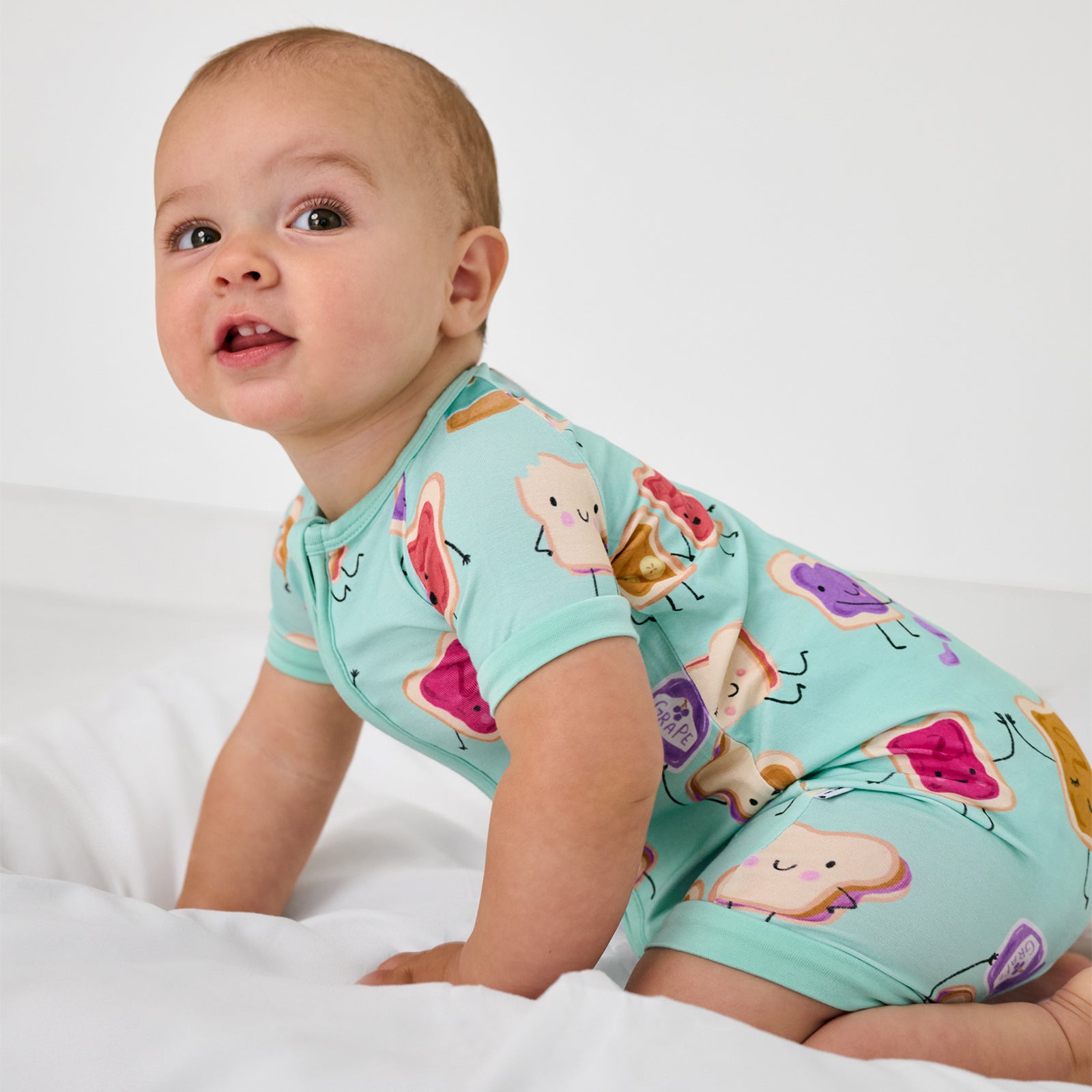 Crawling child wearing the Lunch Buddies Shorty Zippy