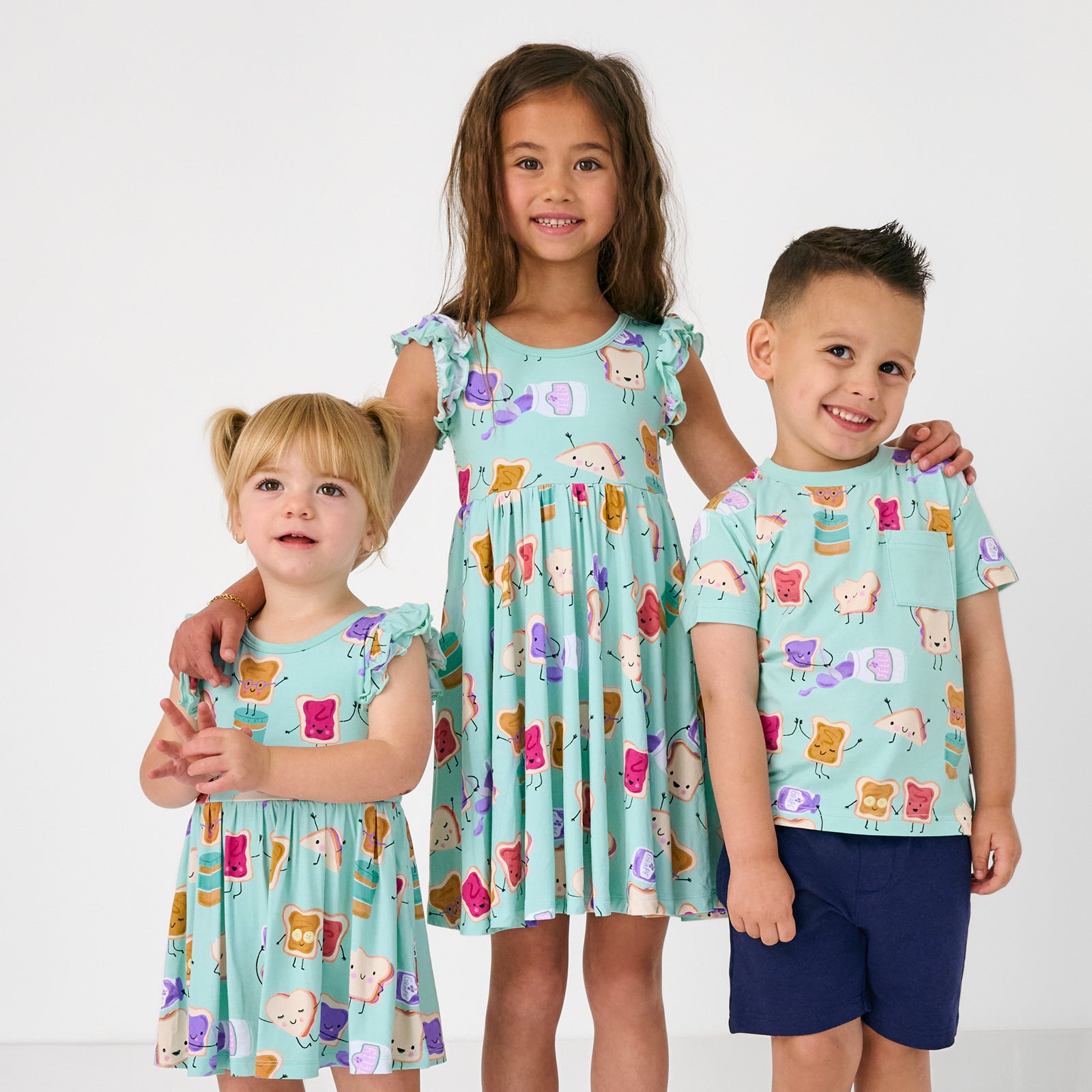 Group of three children wearing matching Lunch Buddies play styles