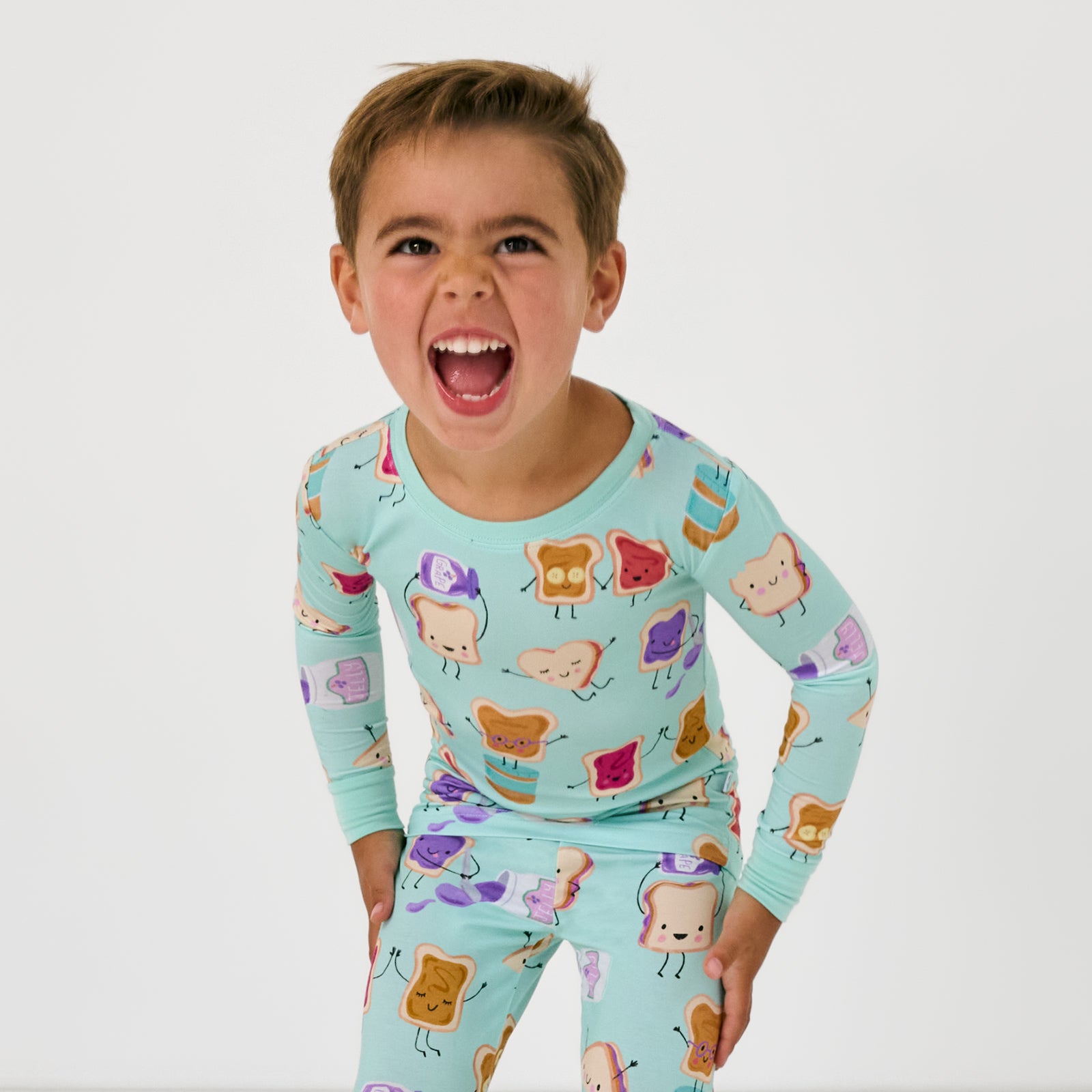 Close up of child wearing the Lunch Buddies Two-Piece Pajama Set