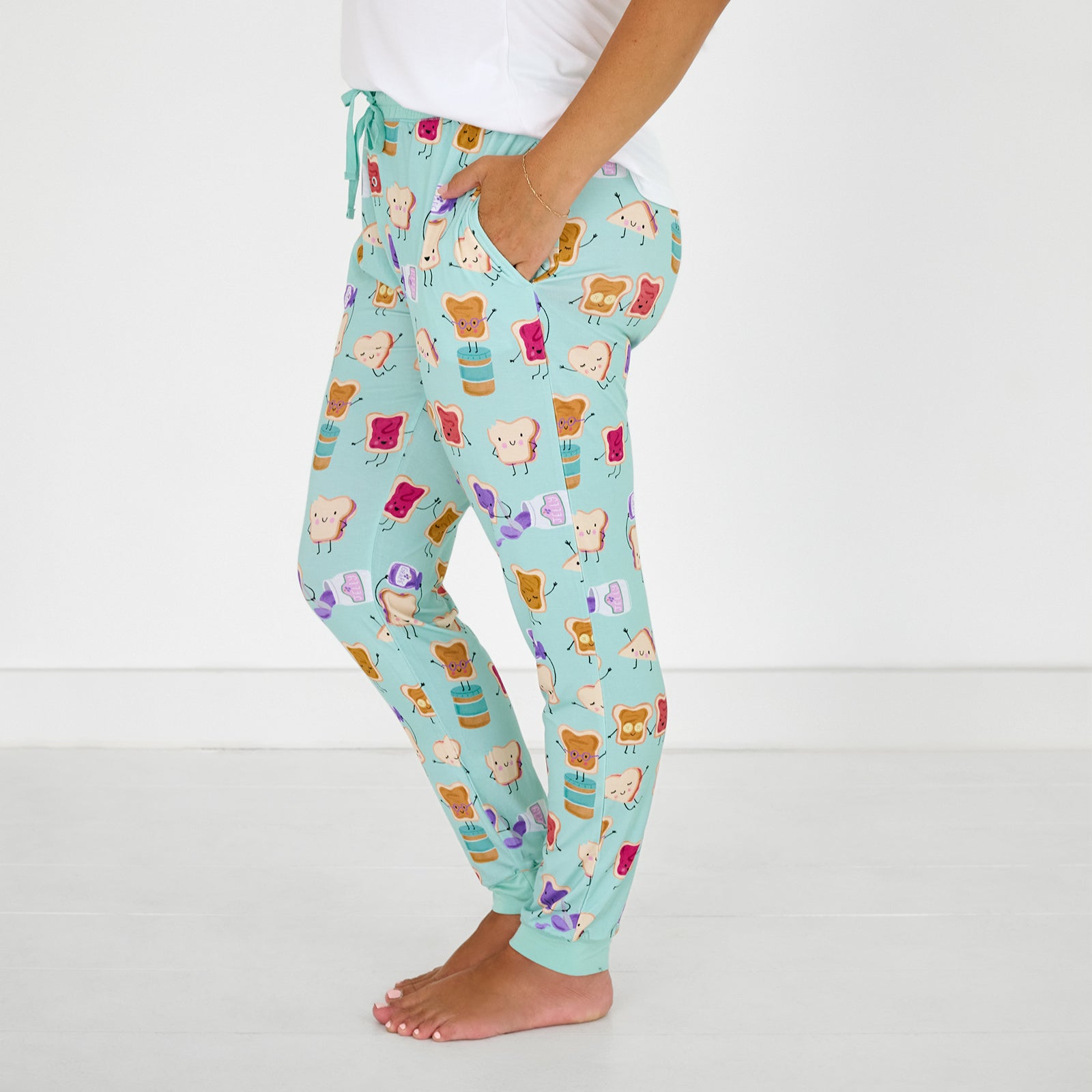 Side view of standing woman wearing the Lunch Buddies Women's Pajama Pants
