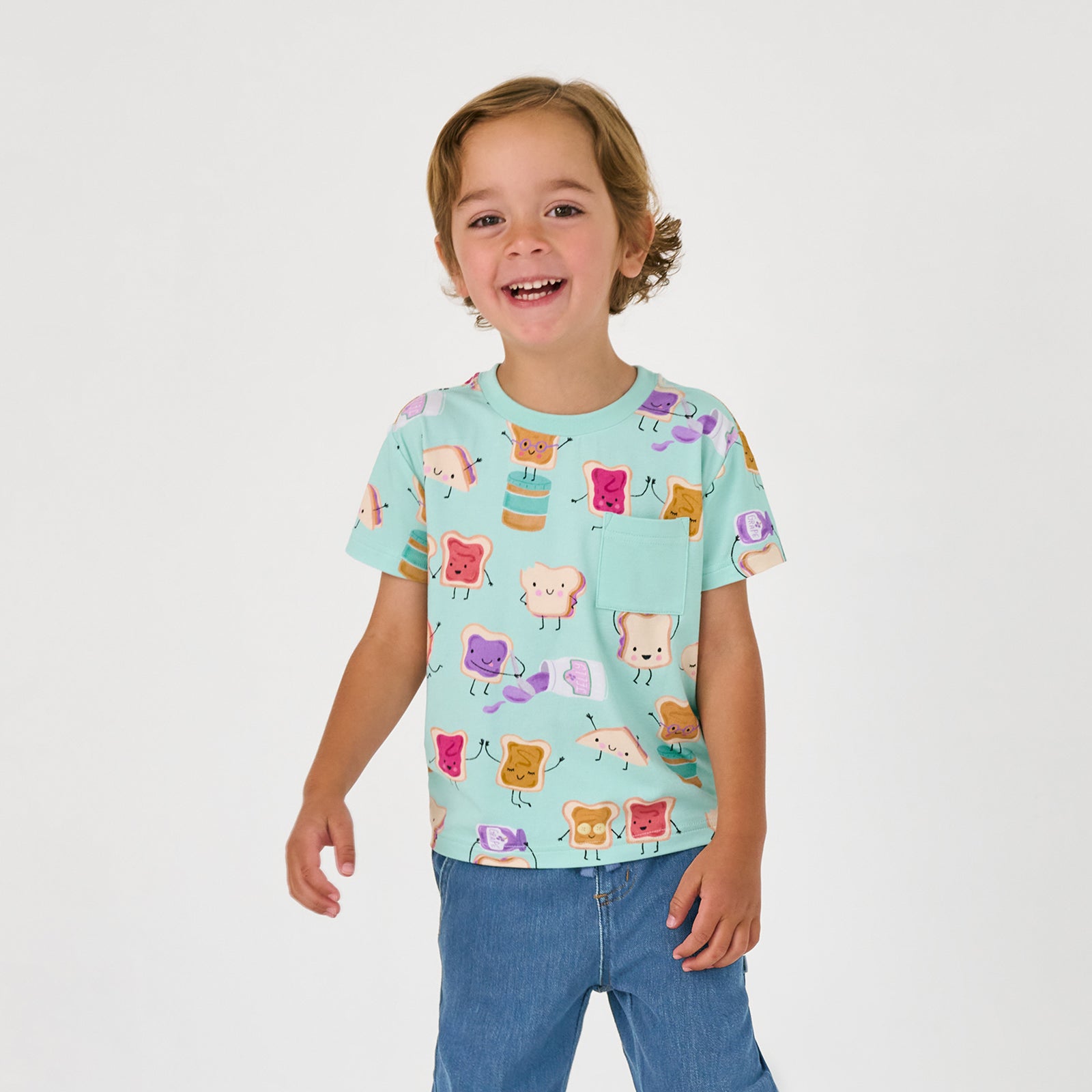 Alternate child wearing the Lunch Buddies Relaxed Pocket Tee with denim joggers