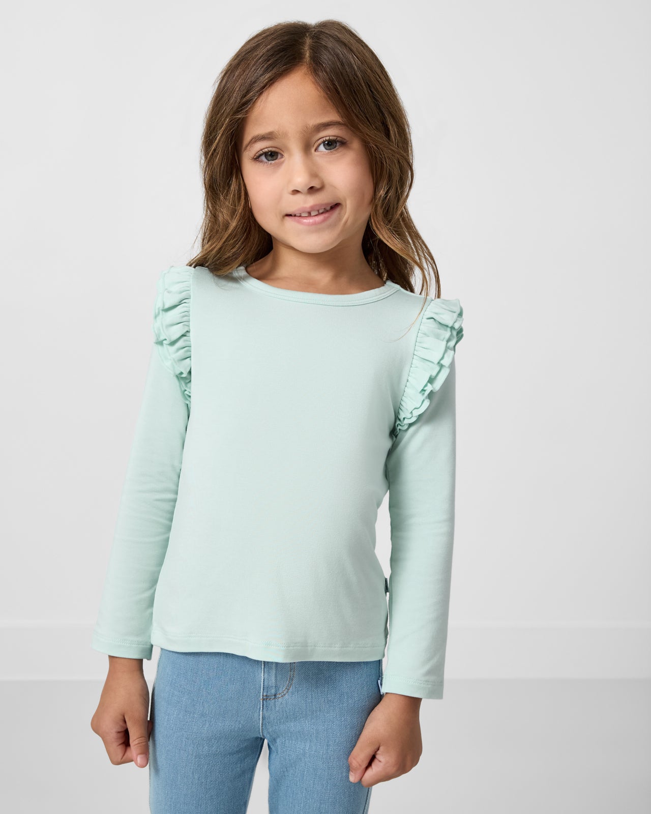 Girl wearing the Mint Mist Flutter Tee
