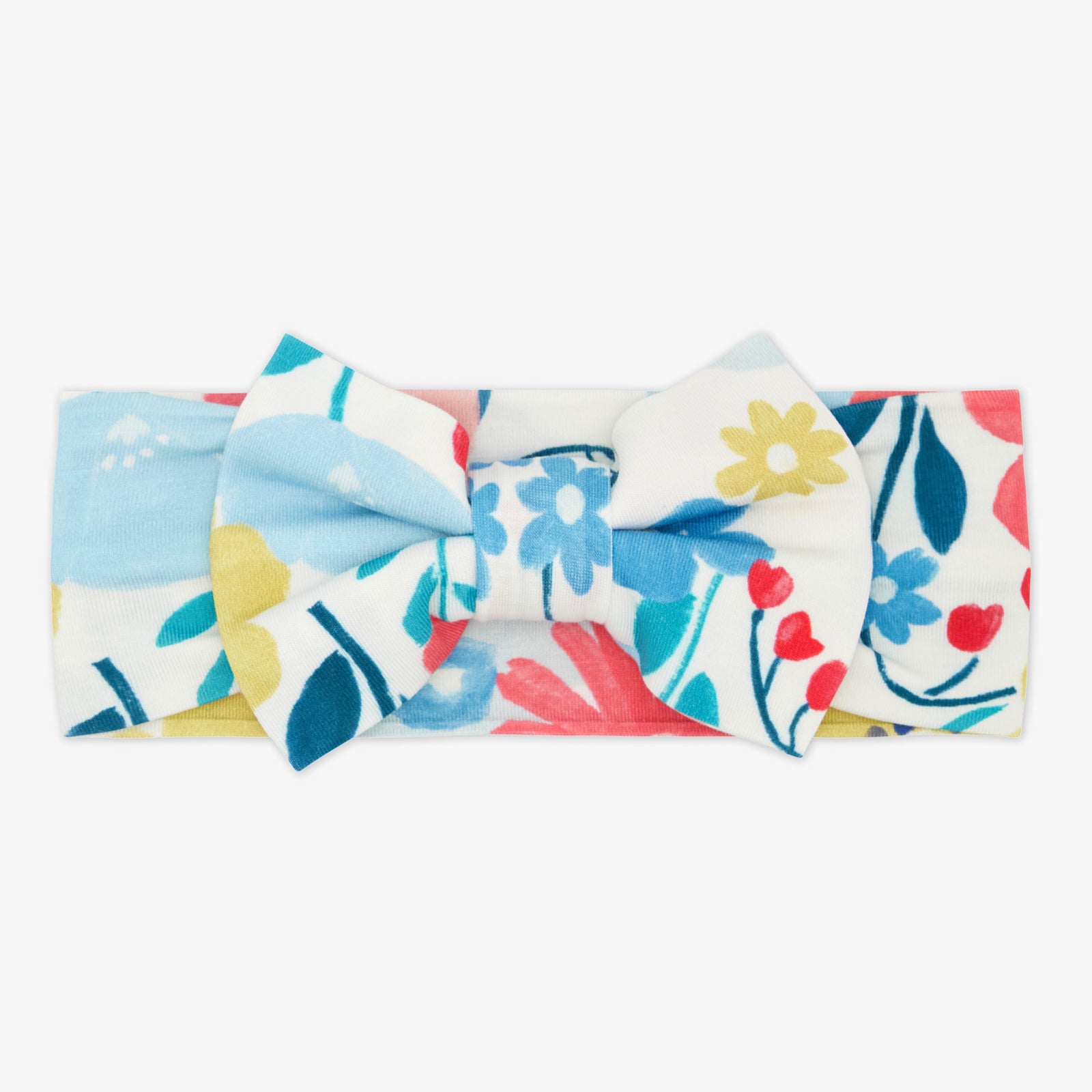 Flat lay of the Midsummer Meadow Luxe Bow Headband