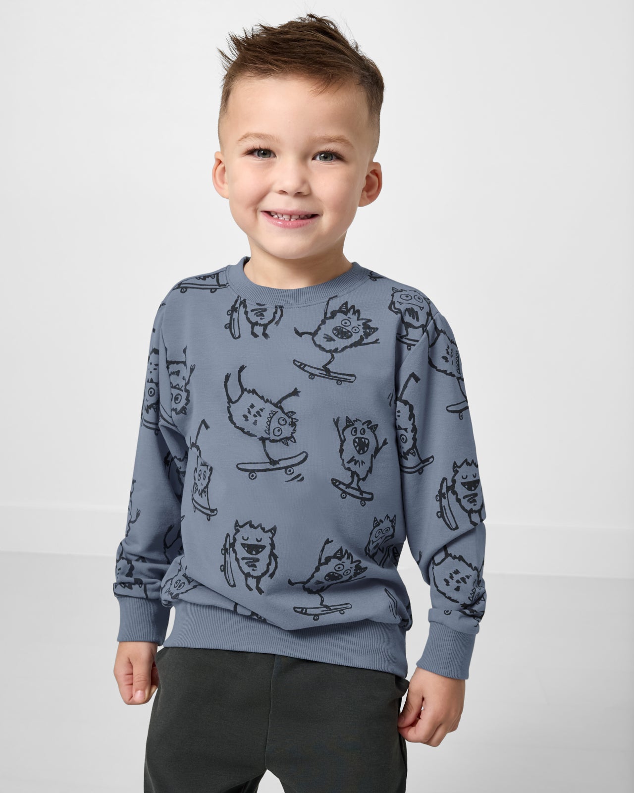 Boy wearing the Monster Moves Crewneck Sweatshirt