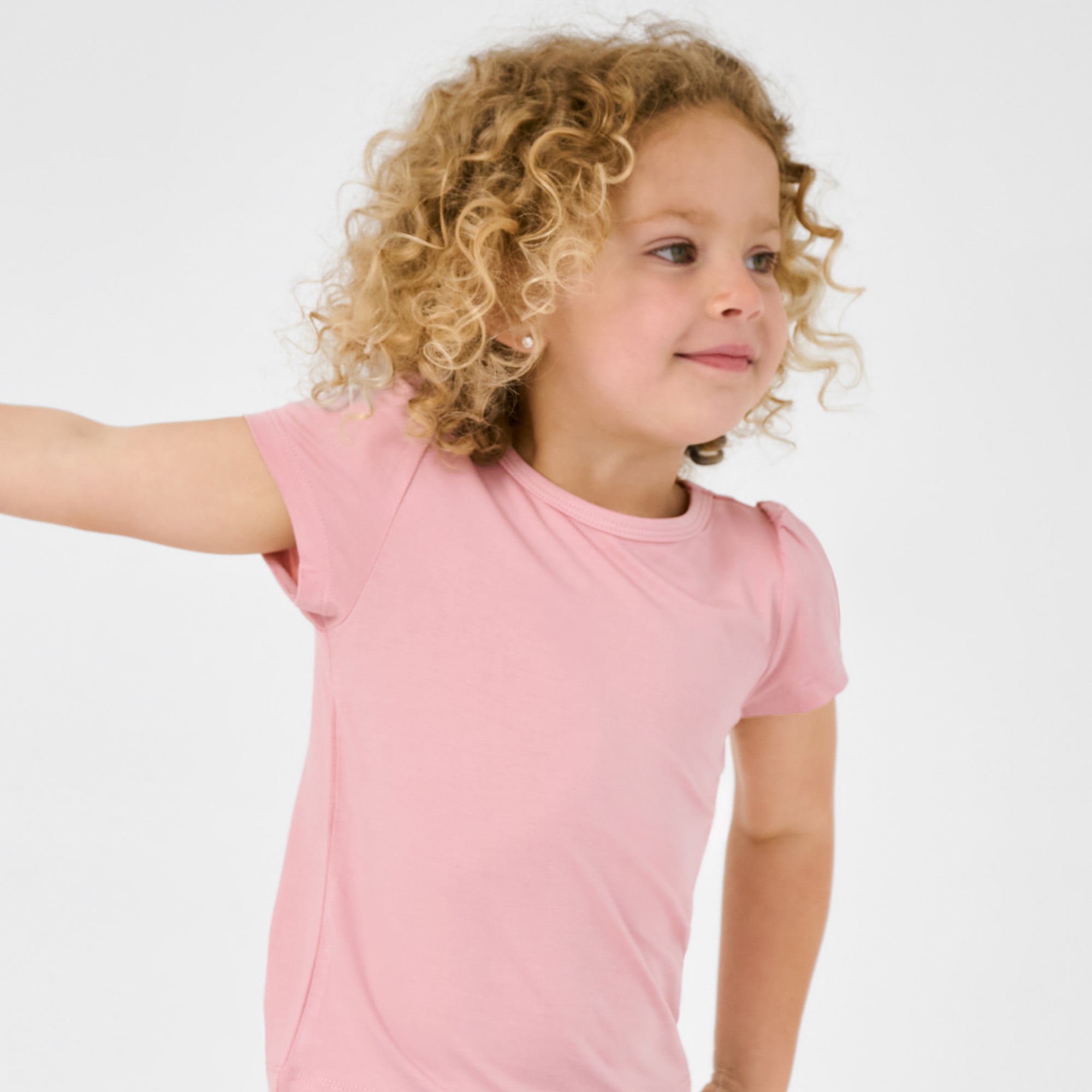 Close up of child wearing the Mauve Blush Puff Sleeve Tee