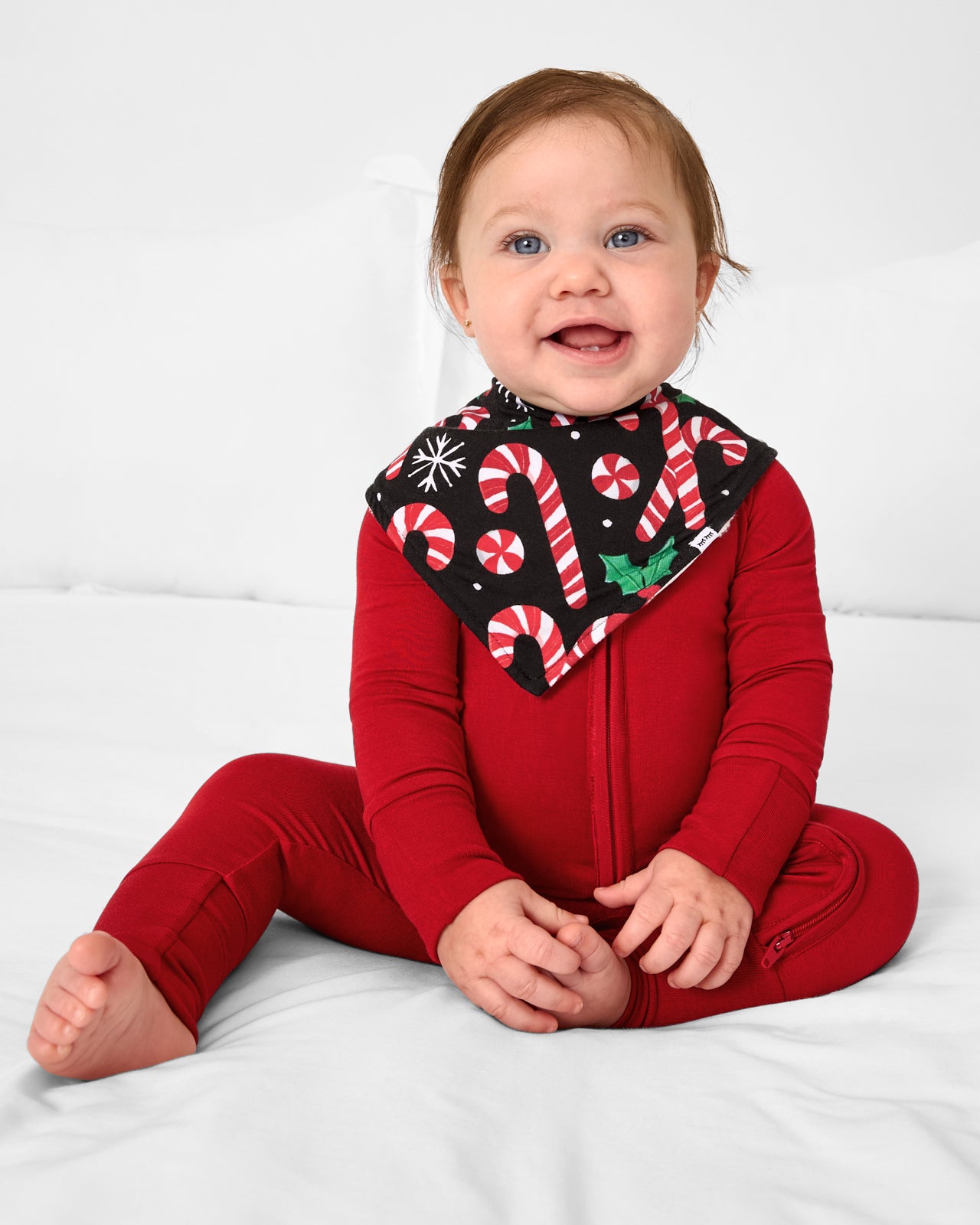 Baby wearing the Merry Mints Bandana Bib