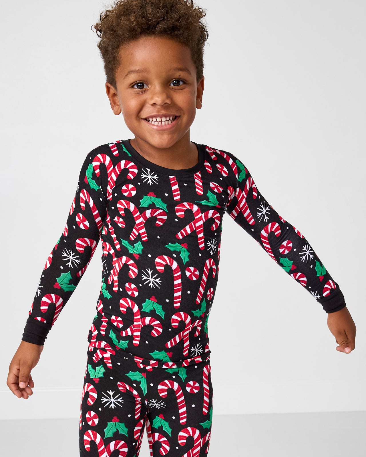 Close up of boy wearing the Merry Mints Two-Piece Pajama Set