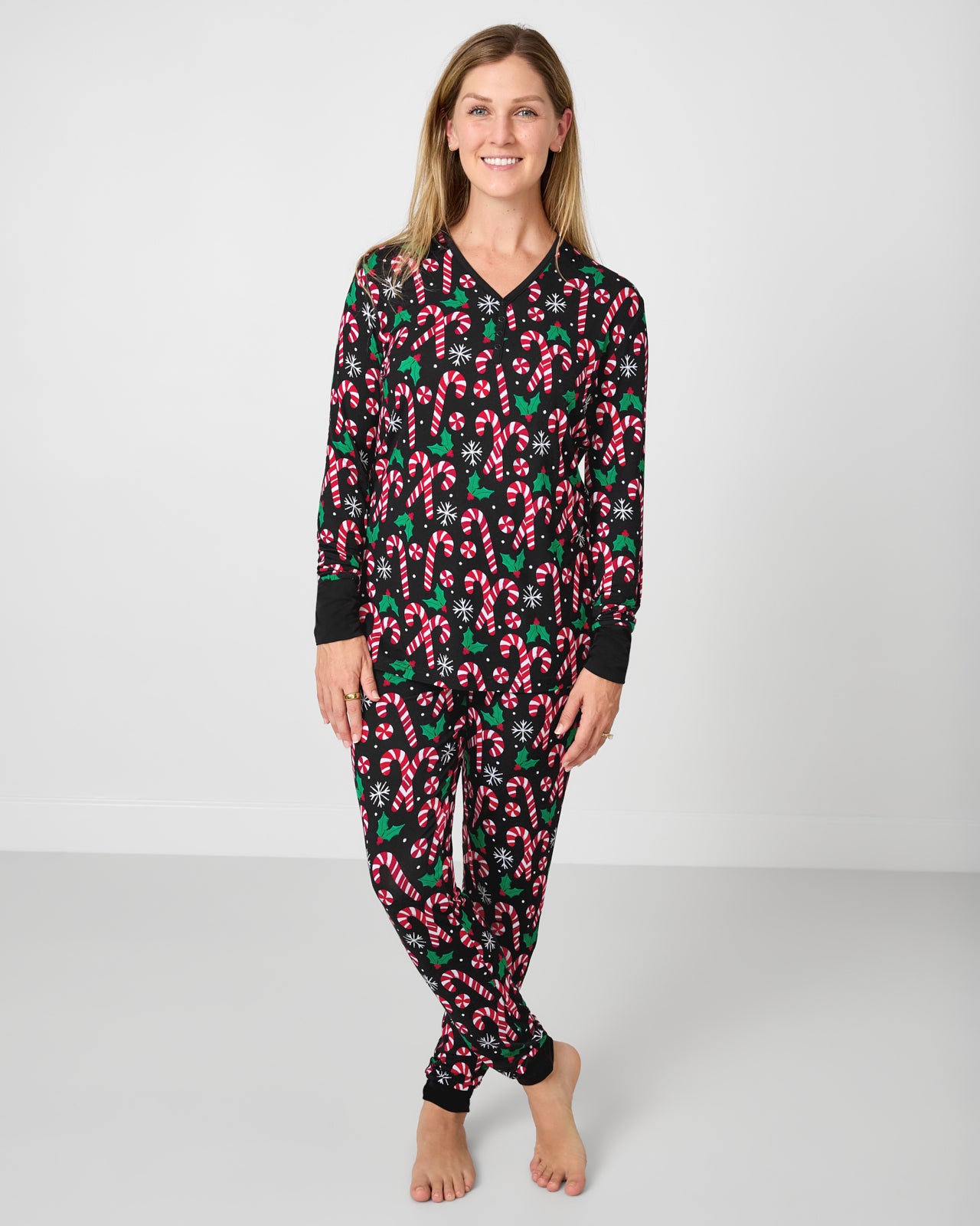 Woman wearing festive Merry Mints Women's Pajama Pants with the matching top