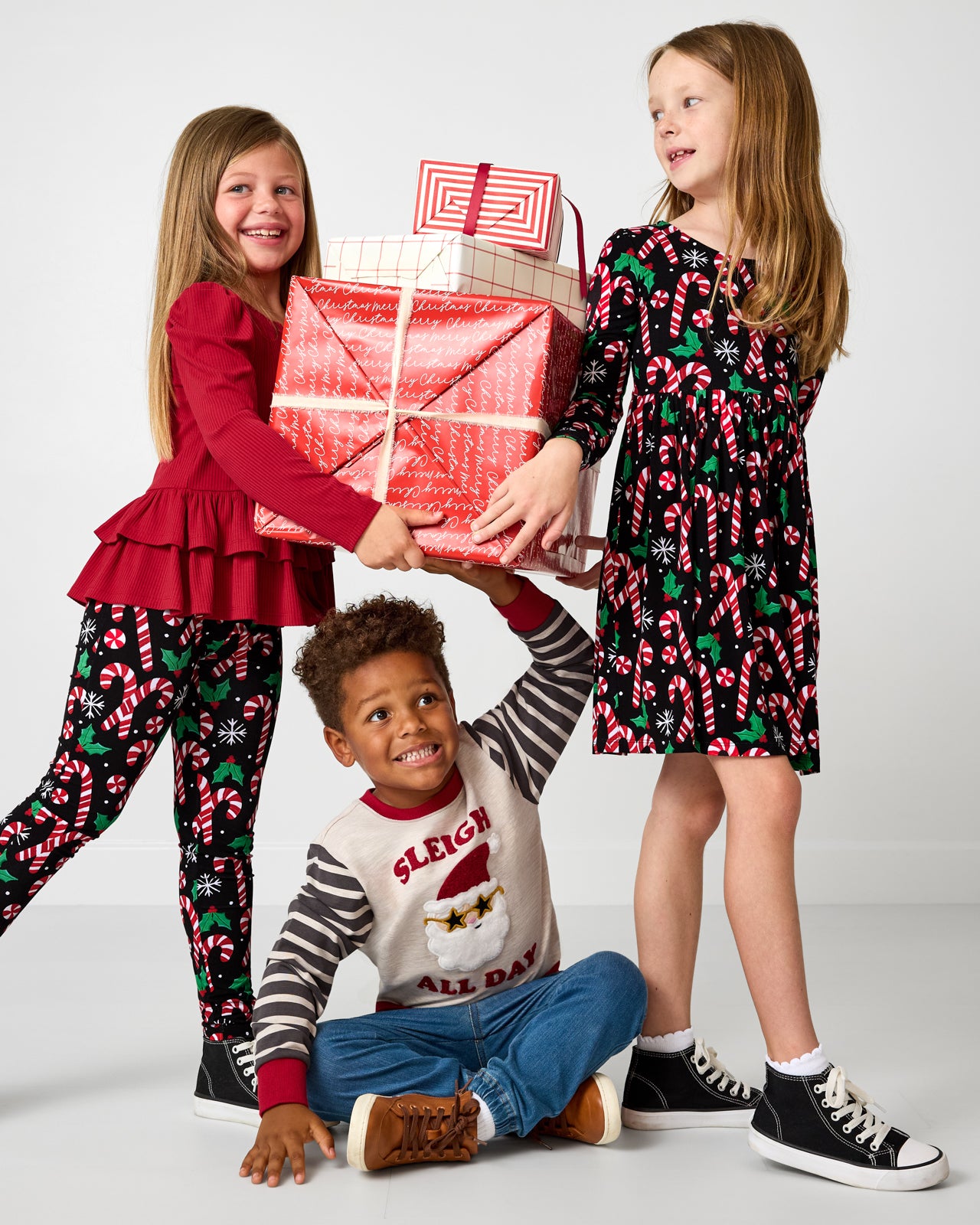 Three children wearing Holiday Play styles