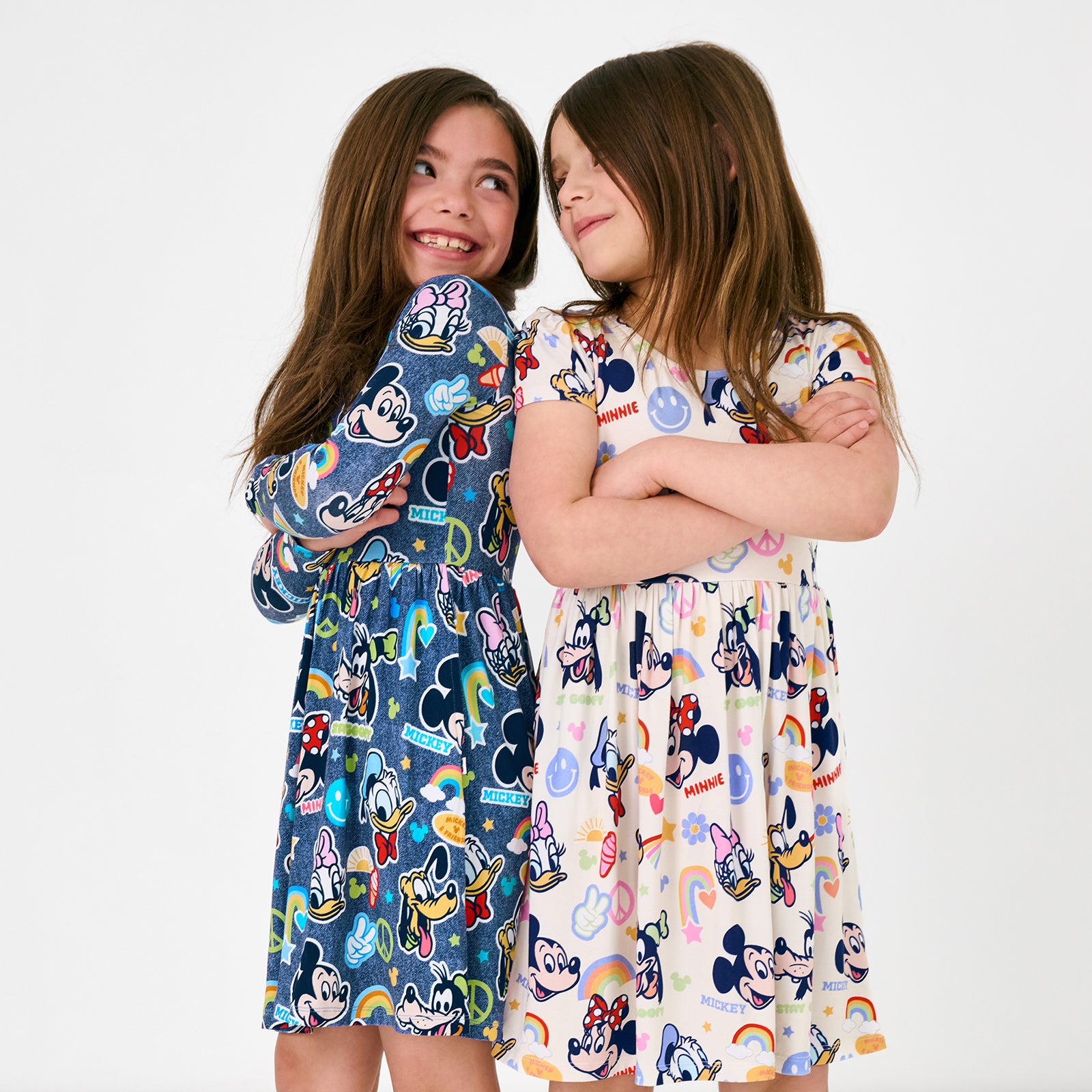 Two girls wearing matching Disney Mickey's Clubhouse Dresses