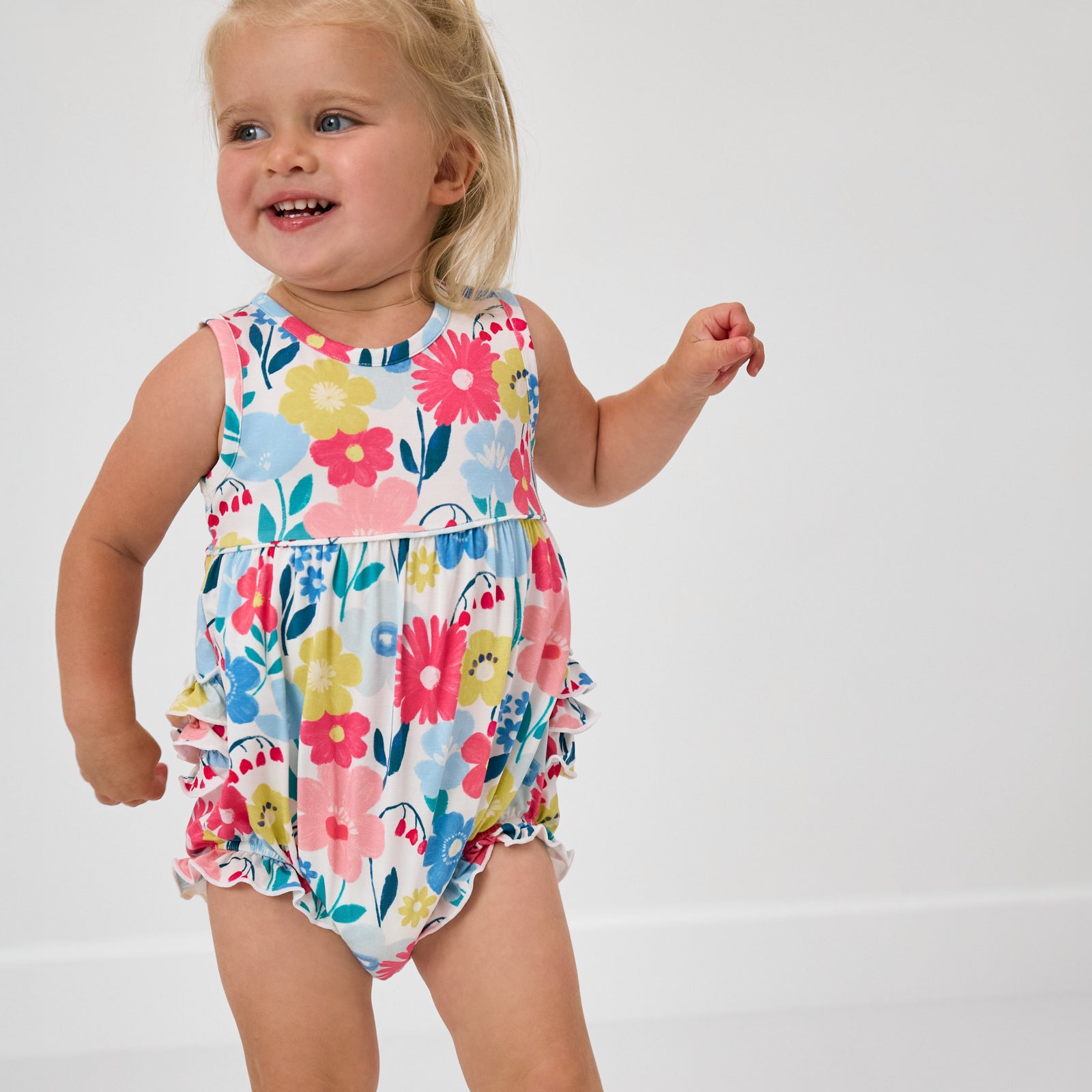 Toddler wearing the Midsummer Meadow Bubble Romper