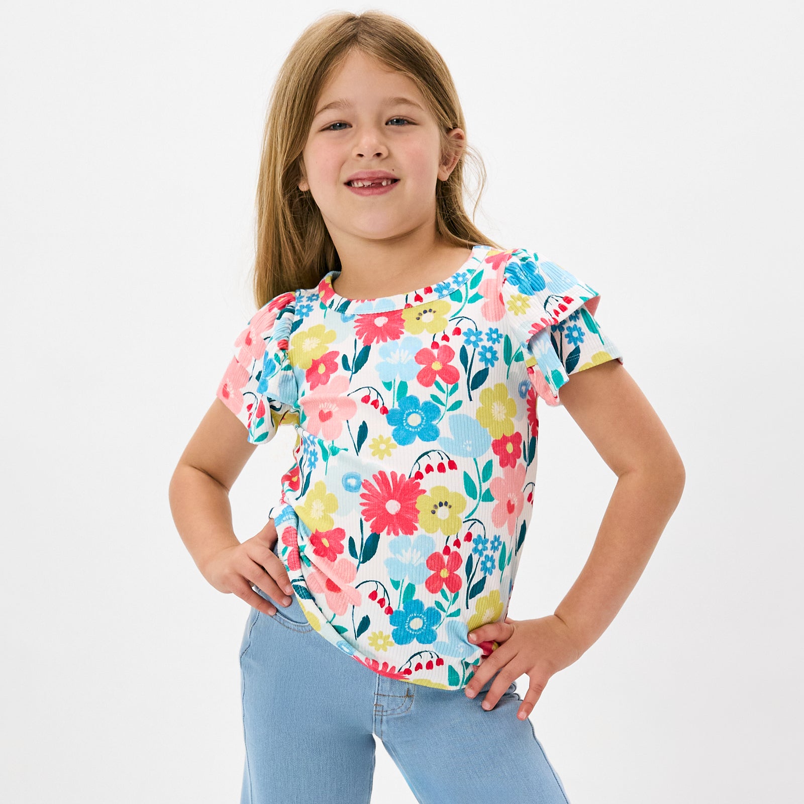 Posing girl wearing the Midsummer Meadow Double Flutter Tee