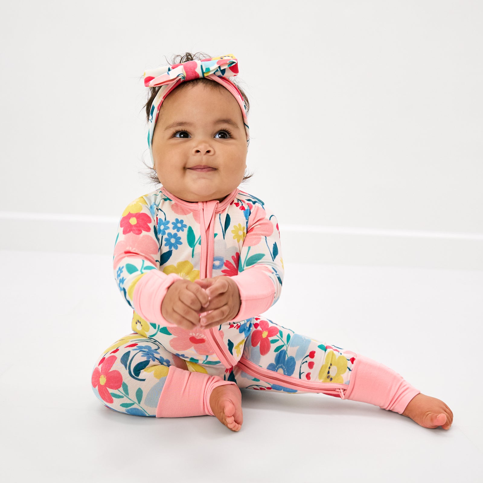 Sitting baby wearing the Midsummer Meadow Luxe Bow Headband