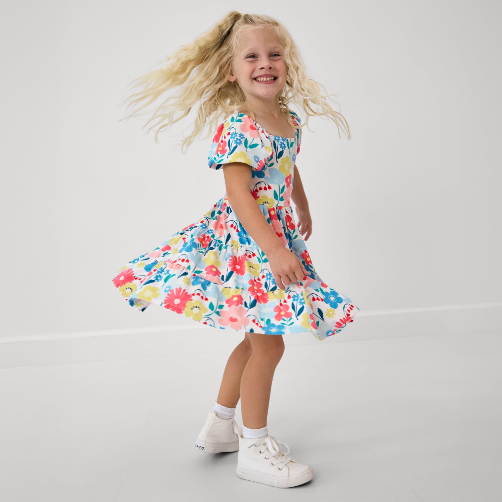 Twirling girl wearing the Midsummer Meadow Peasant Dress