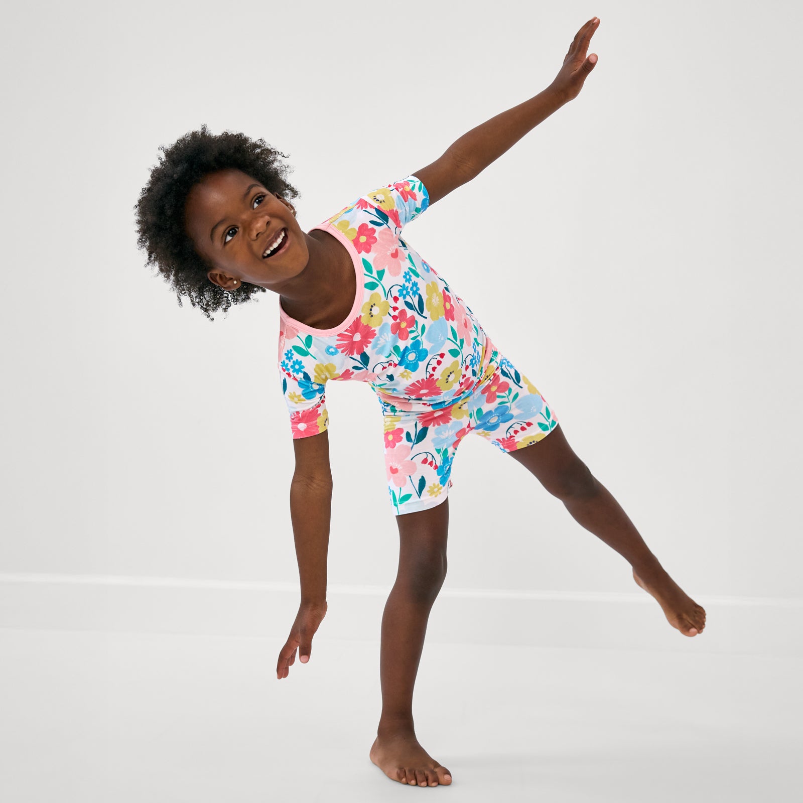 Posing girl wearing the Midsummer Meadow Two-Piece Short Sleeve & Shorts Pajama Set