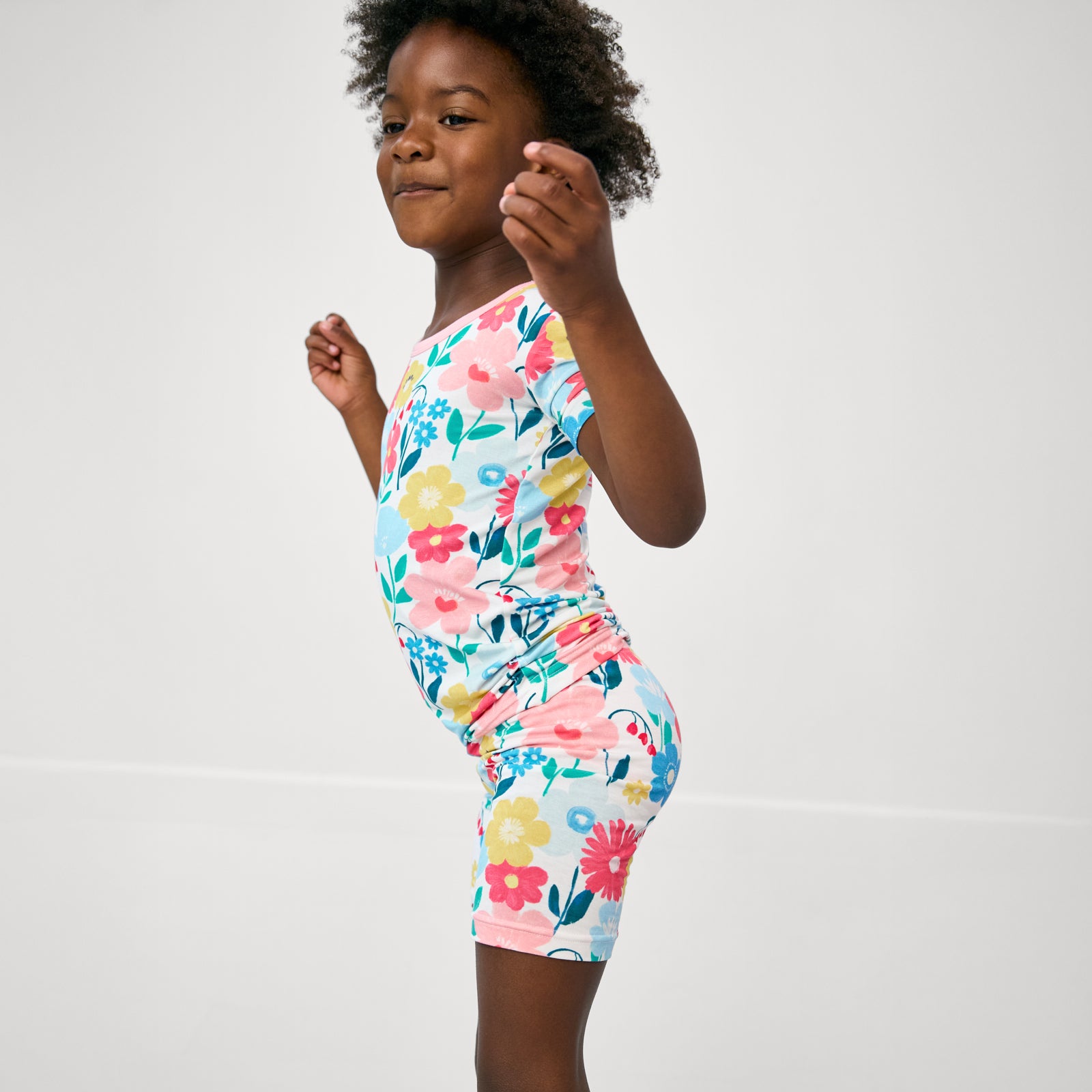 Close up of girl wearing the Midsummer Meadow Two-Piece Short Sleeve & Shorts Pajama Set