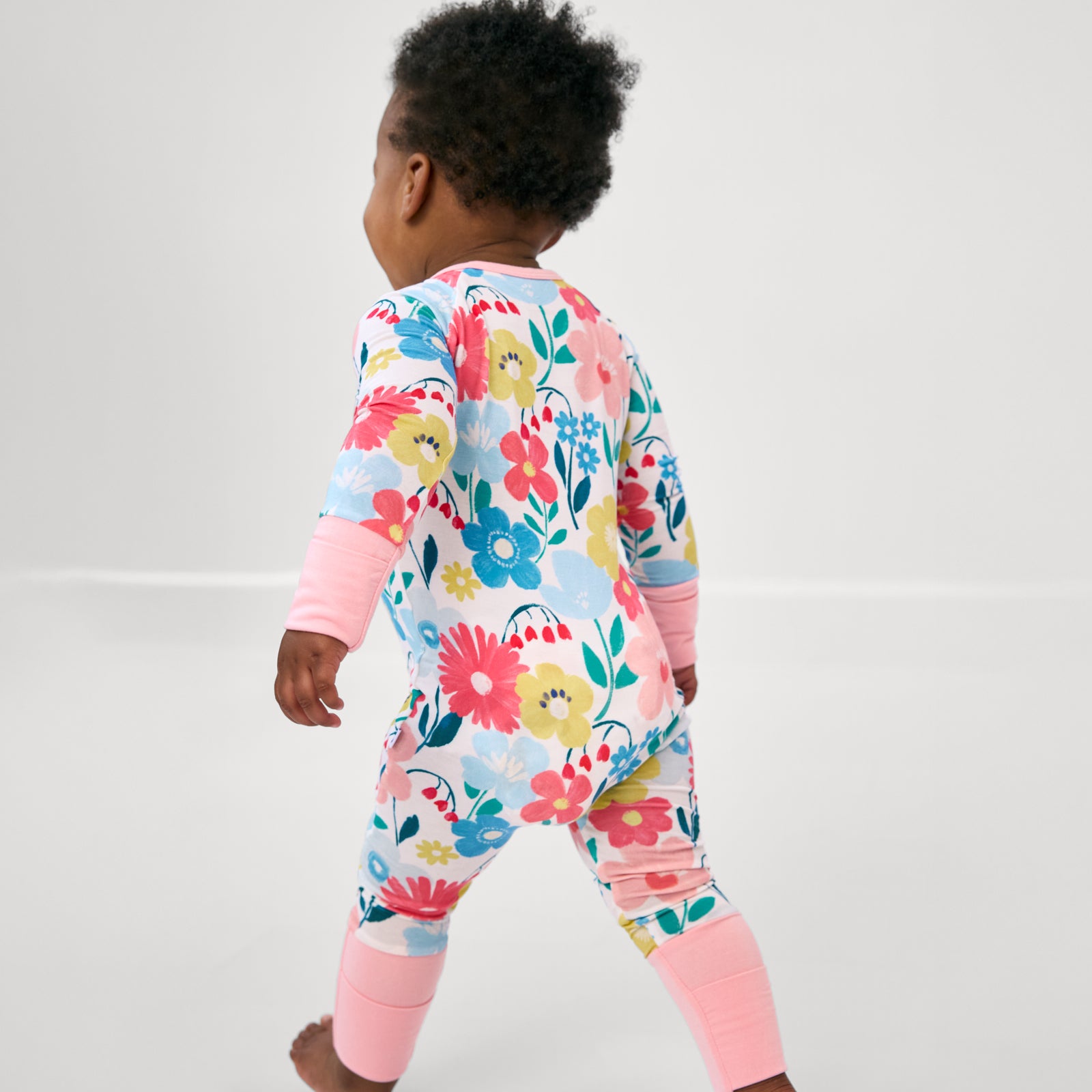 Back view of toddler wearing the Midsummer Meadow Zippy