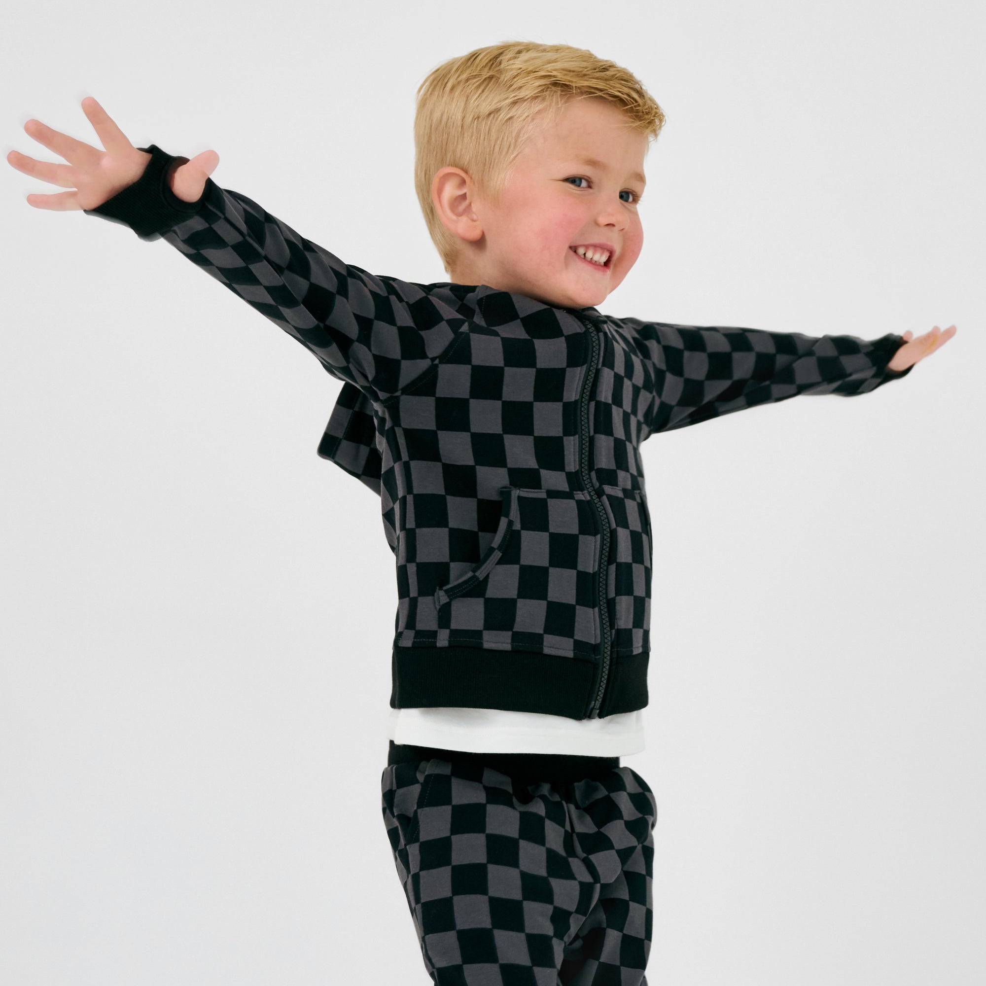 Front view of posing boy wearing the Monochrome Checks Zip Hoodie