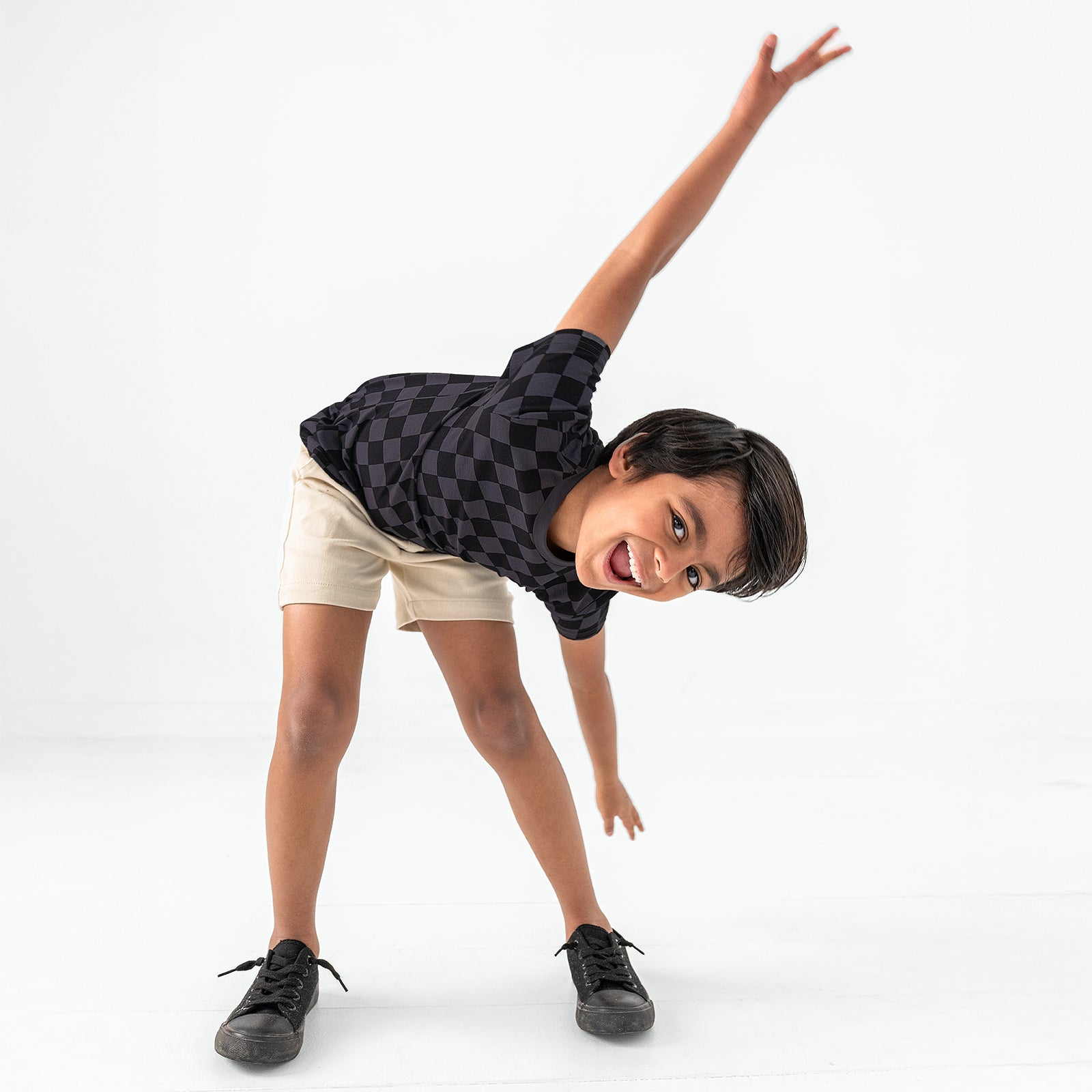 Posing child wearing the Monochrome Checks Short Sleeve Relaxed Tee