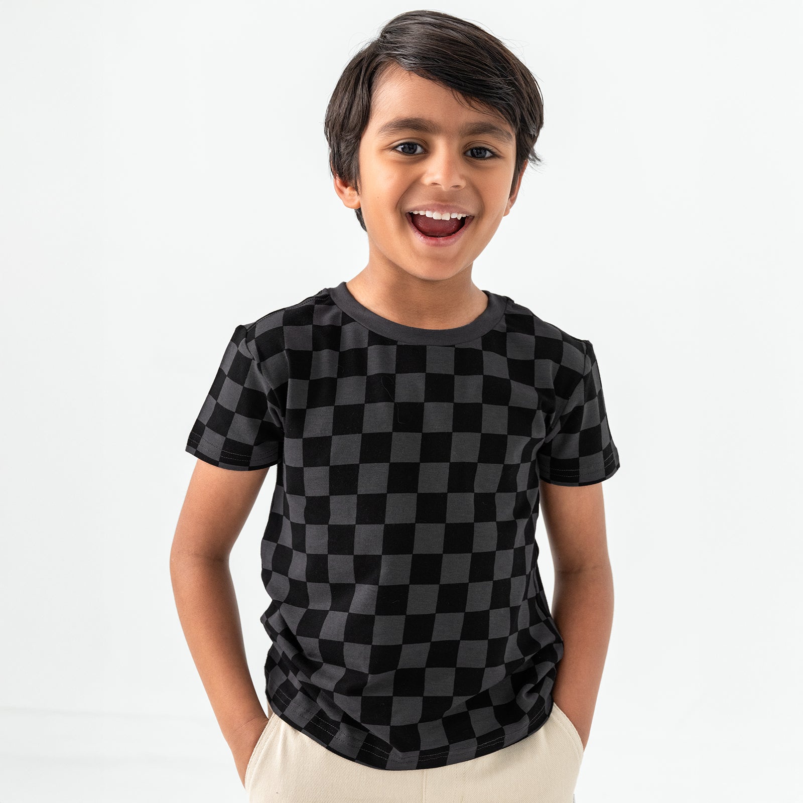 Standing child wearing the Monochrome Checks Short Sleeve Relaxed Tee