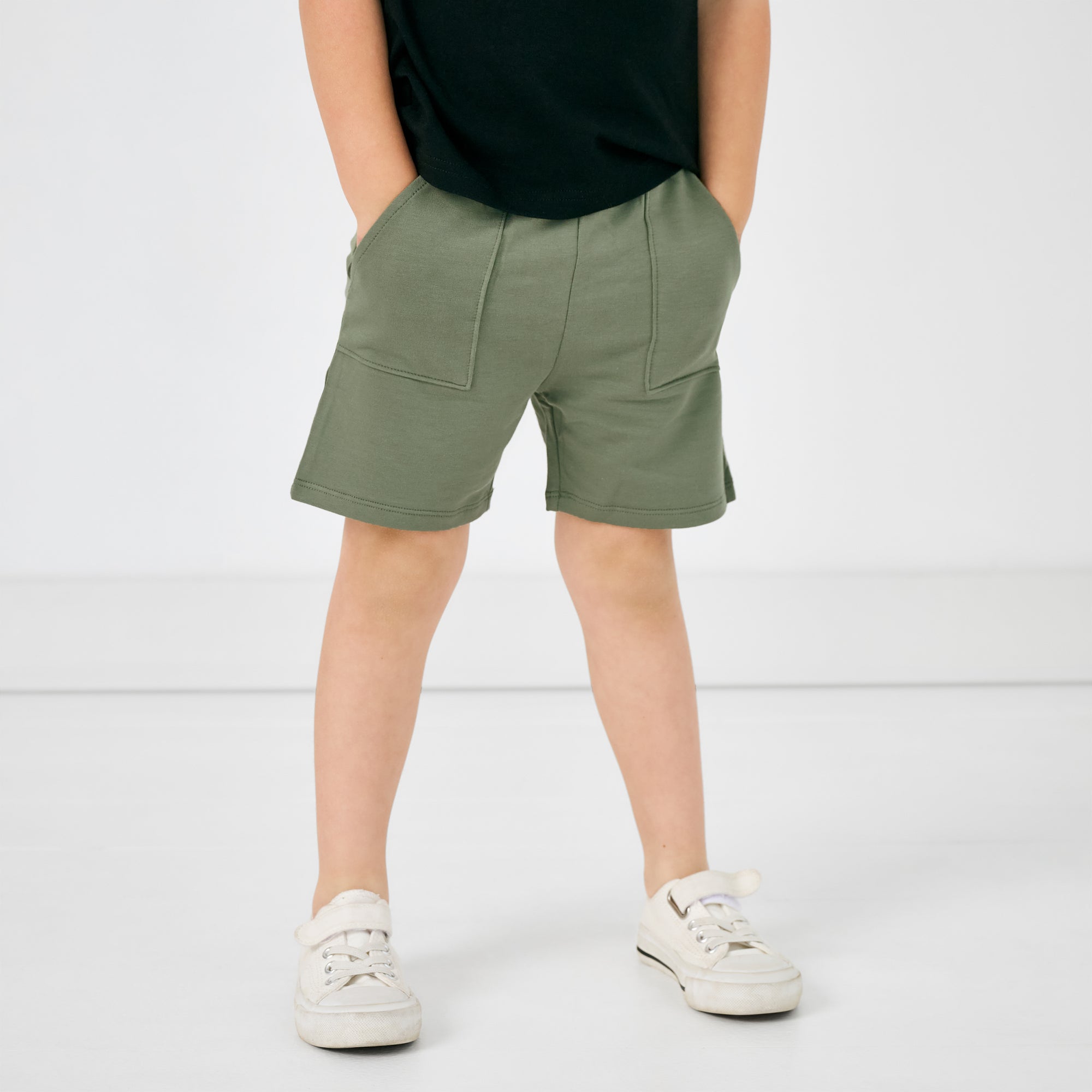 Close up of child wearing the Moss Shorts