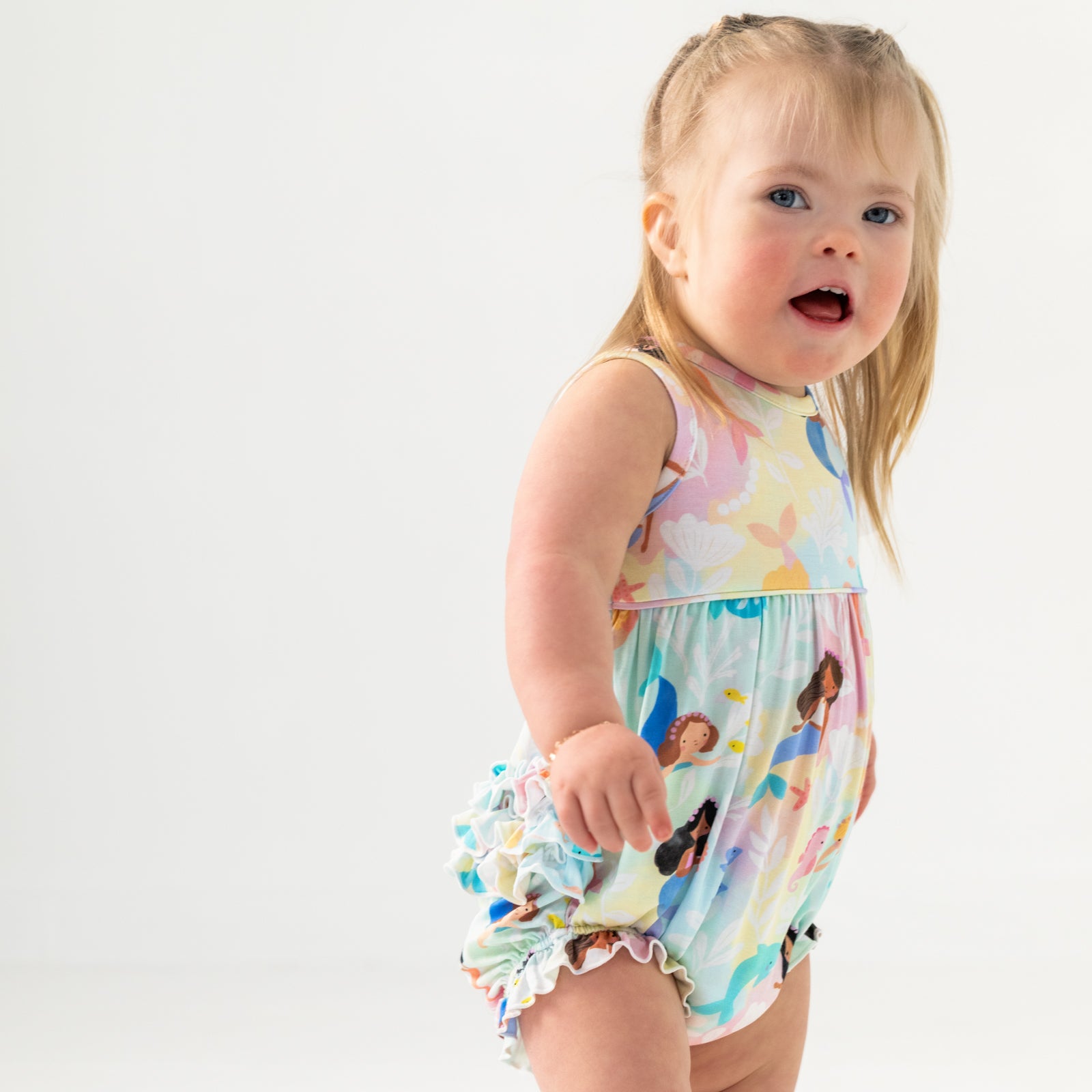 Close up of child wearing the Mystic Mermaids Bubble Romper