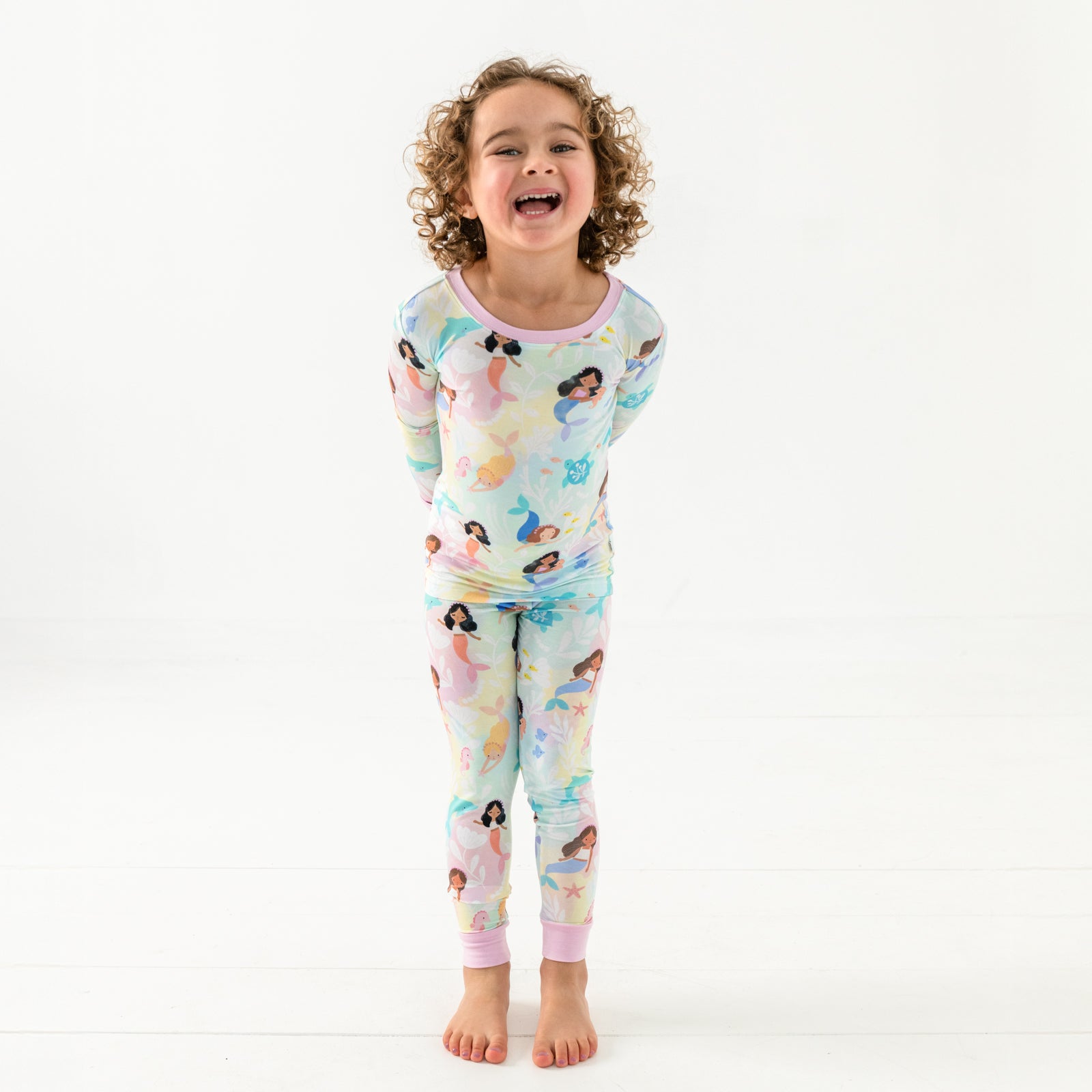 Standing child wearing the Mystic Mermaids Two-Piece Pajama Set
