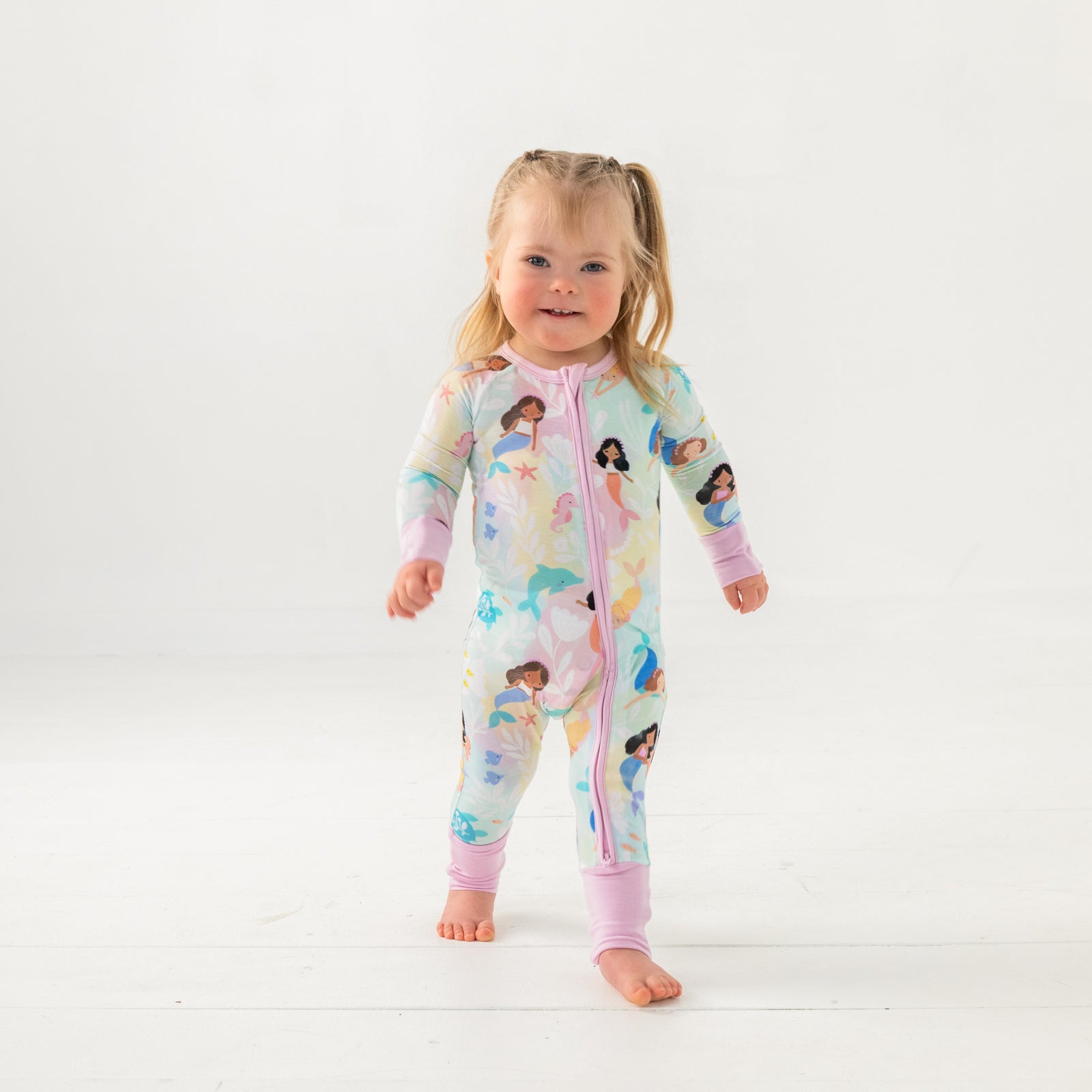 Walking child wearing the Mystic Mermaids Zippy