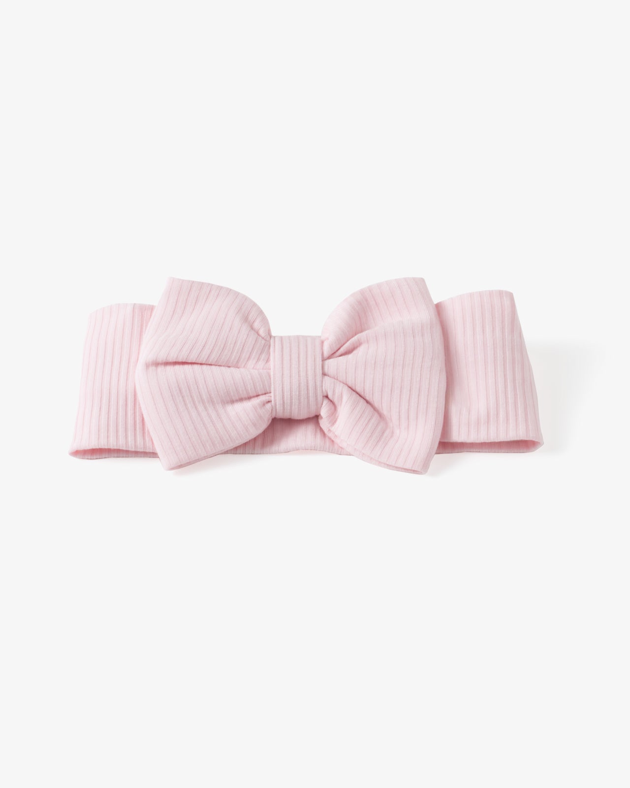 Flat lay of the Prima Pink Ribbed Luxe Bow Headband