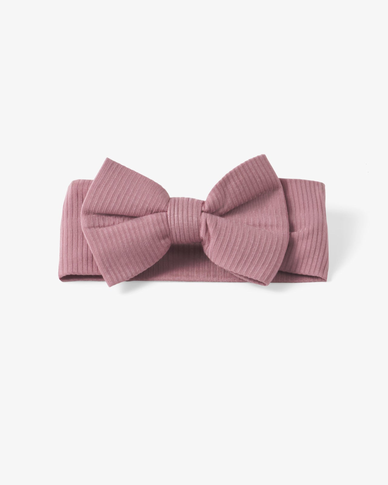 Flat lay of the Rosewood Ribbed Luxe Bow Headband