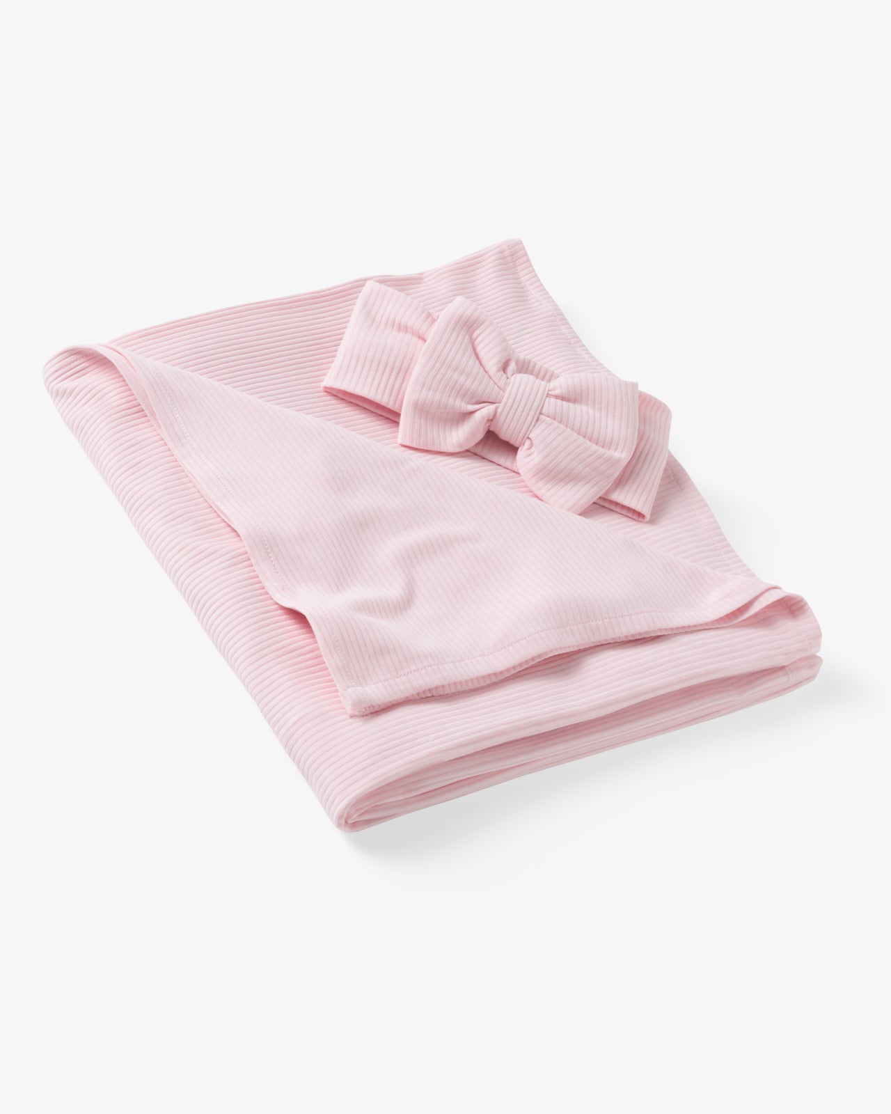 Flat lay of the Prima Pink Ribbed Swaddle & Luxe Bow Headband Set