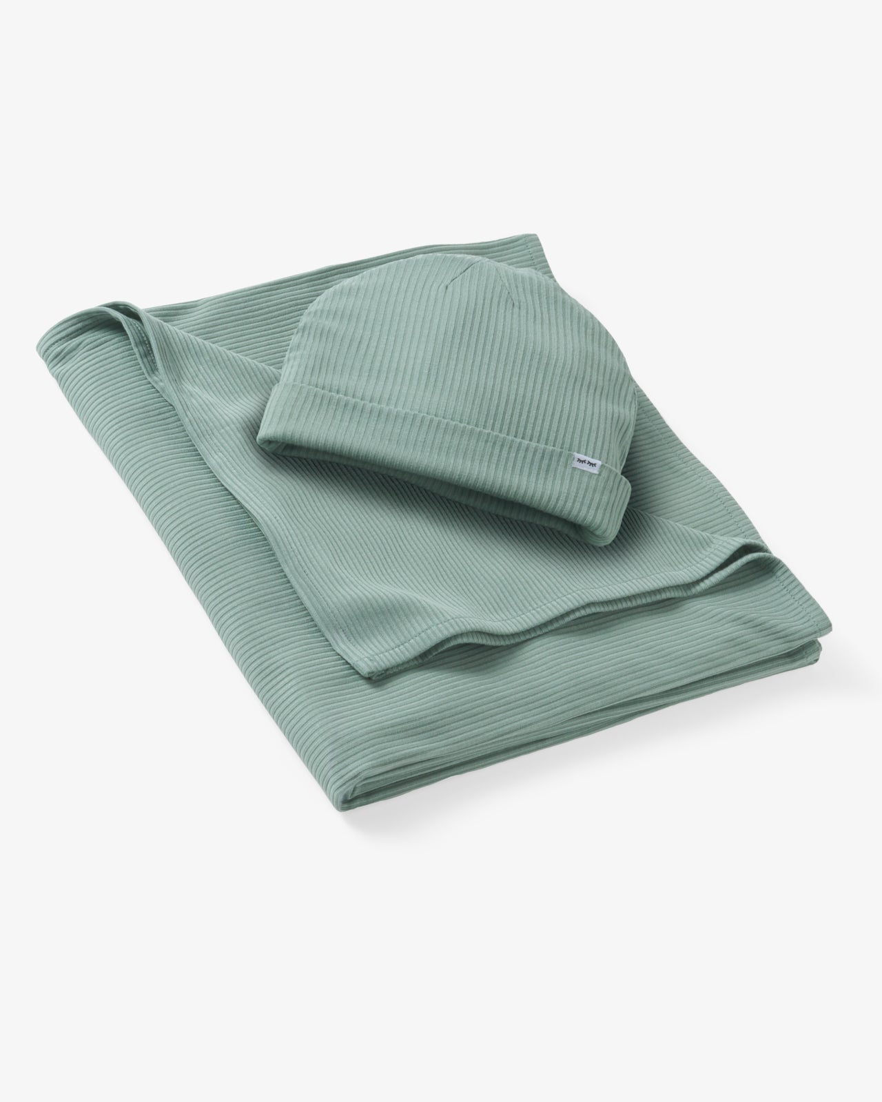 Flat lay of the Willow Baby Ribbed Swaddle & Infant Beanie Set
