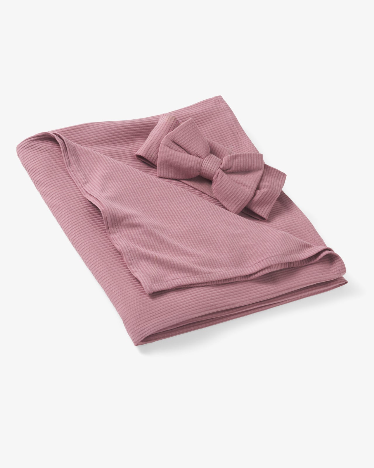 Flat lay of the Rosewood Ribbed Swaddle & Luxe Bow Headband Set