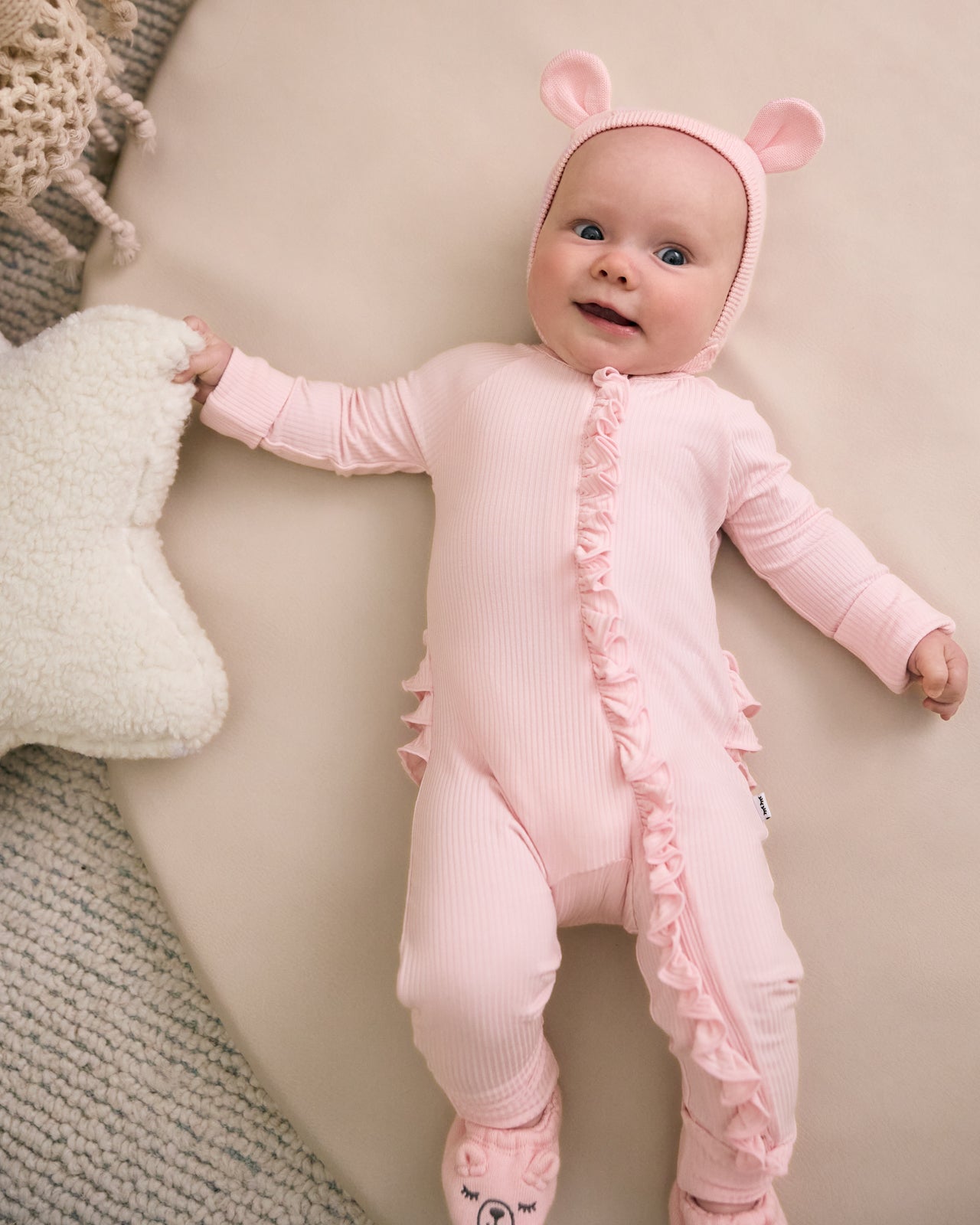 Newborn wearing the Prima Pink Bear Bonnet